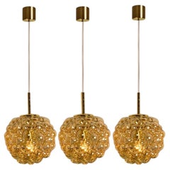 1 of the 3 Bubbled Glass and Brass Pendants by Helena Tynell, Germany 1970
