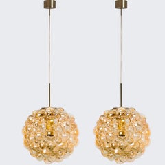 1 of the 2 Large Bubbled Glass and Brass Pendants by Helena Tynell, Germany 1970