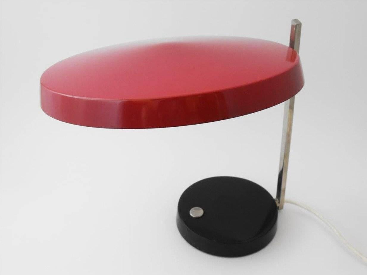 Oslo desk lamp by Heinz Pfaender from Hillebrand. From 1962. In red, black and chrome. You can swivel and focus the hood of this desk lamp (see pictures). Striking on the lamps of Hillebrand is the good quality and the push button in the middle of