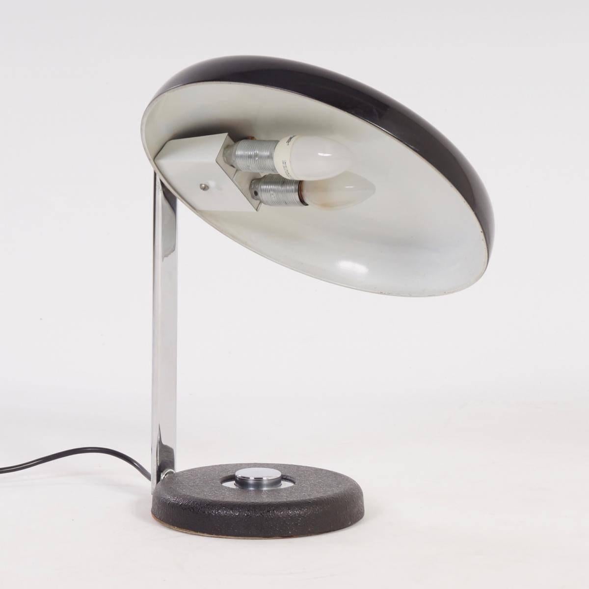 Pair of Oslo desk lamps by Heinz Pfaender from Hillebrand from 1962. You can swivel and focus the hood of this desk lamp (see pictures). Striking on the lamps of Hillebrand is the good quality and the push button in the middle of the foot. The lamp