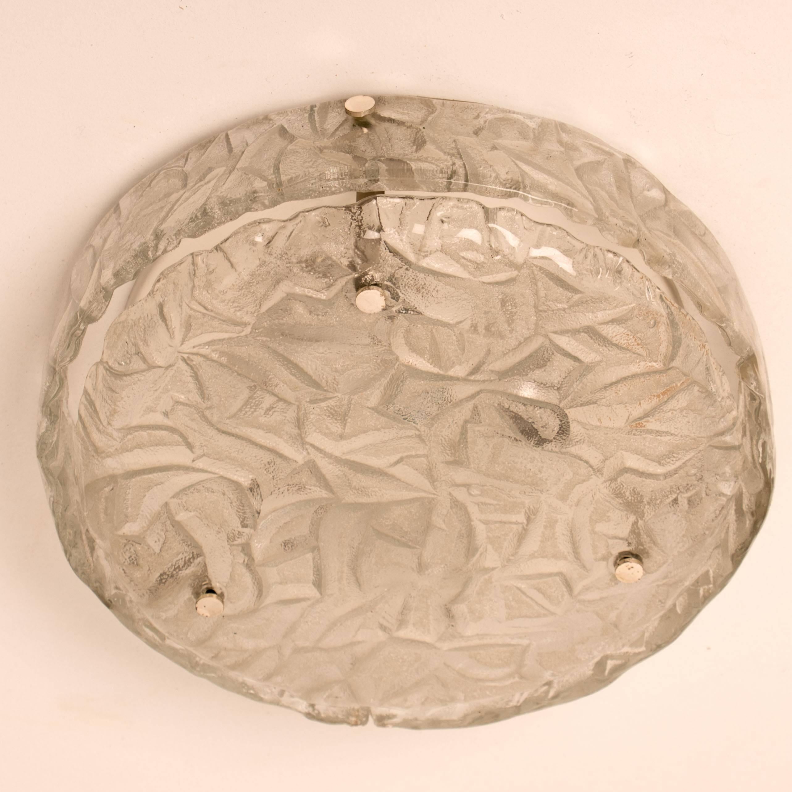 A handmade high quality light fixture made by Hillebrand, Germany, manufactured in the midcentury, circa 1970 (at the end of 1960s and beginning of 1970s). 

This flush mount or ceiling light features four sheets made of handmade, think textured