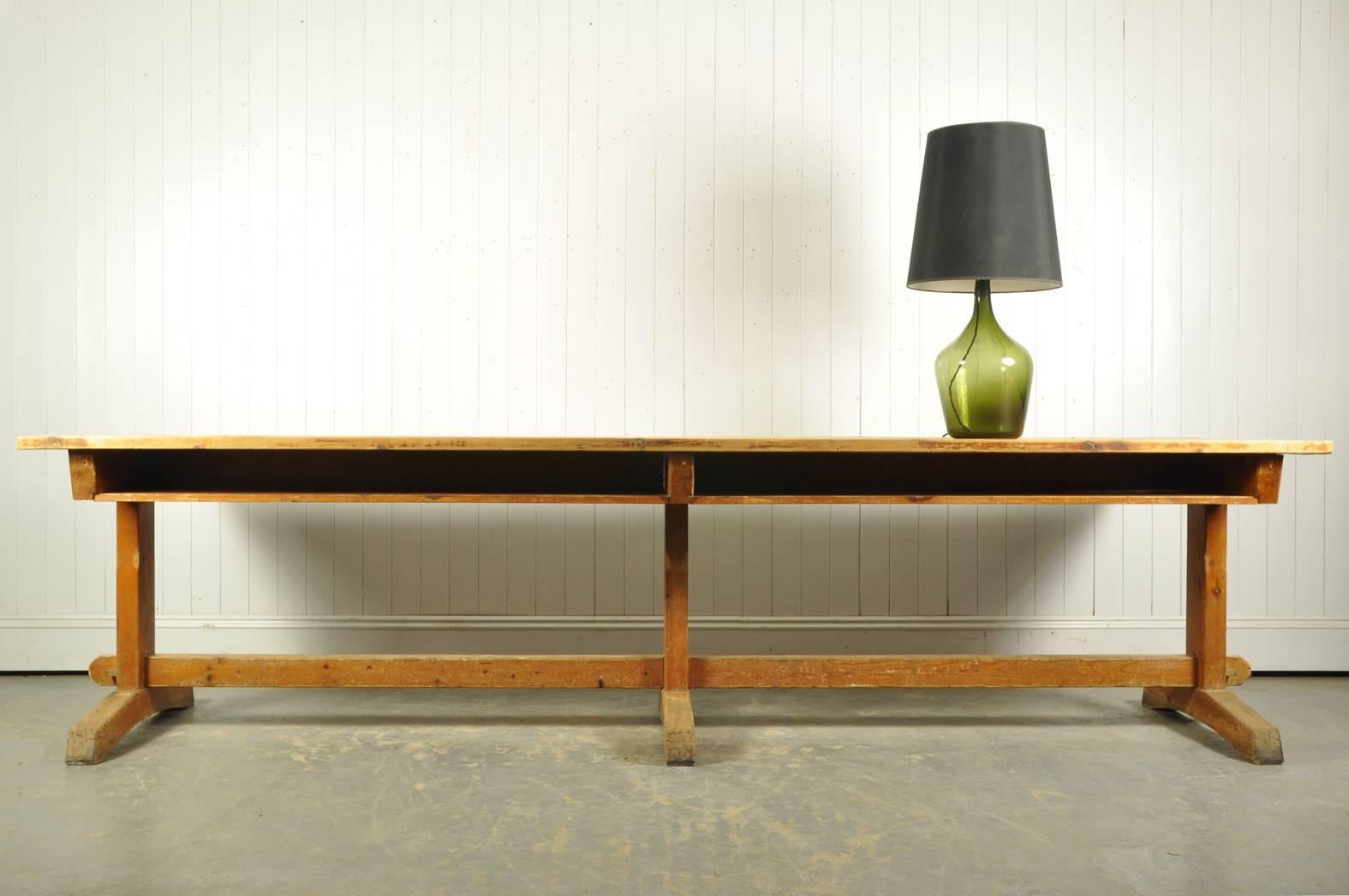 This unusual table was reclaimed from a University in Belgium. 

It has some of the wonderful original paint to the base which we have kept very much as we found it.  It is quite raw in appearance as we wanted it to keep looking as true to its