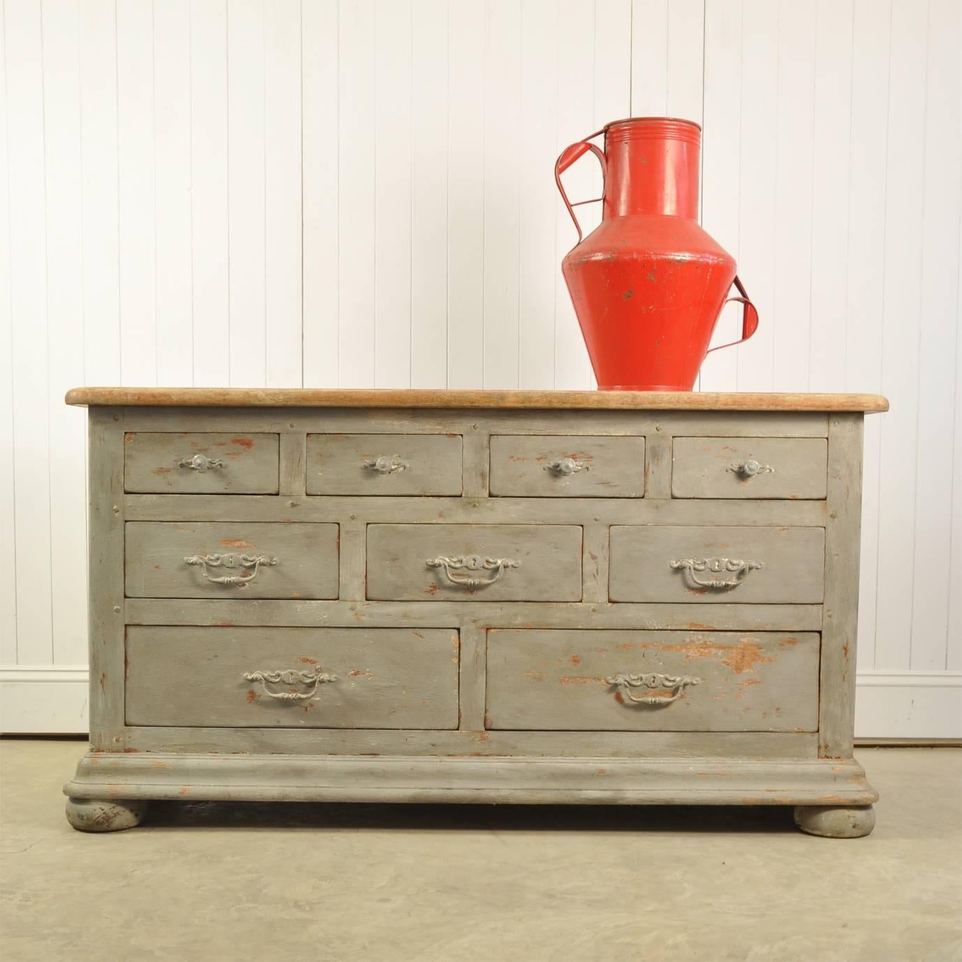 This vintage chest of drawers is circa 1950s and it is very well made out of oak. 

The top is in its original sun bleached condition, whereas the body has been repainted in a French Grey - still retaining plenty of character.  The drawers have