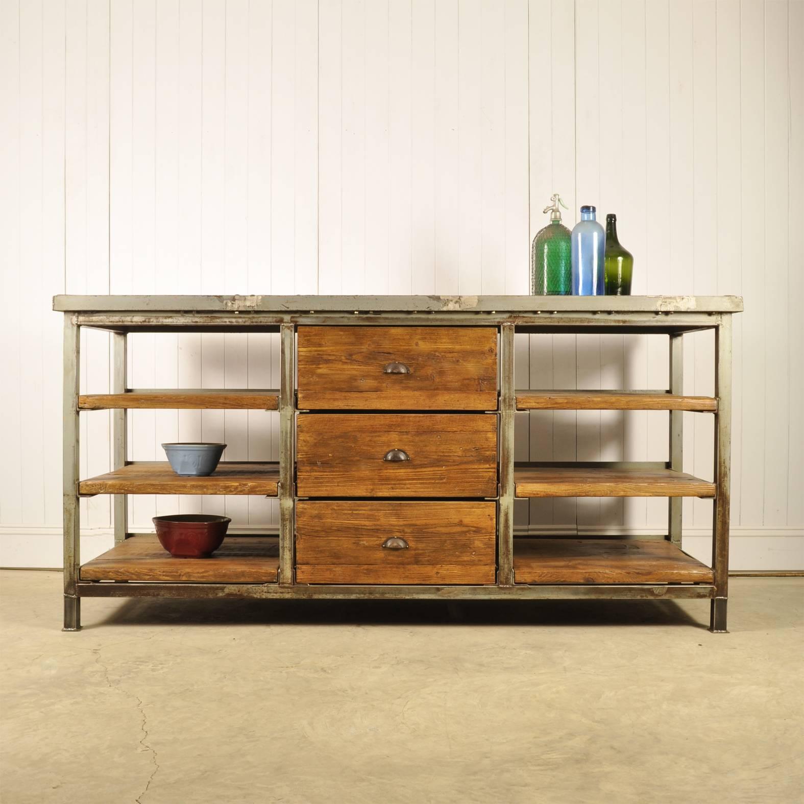 We sourced this chunky vintage workbench from a factory in Holland. It is 1960s.

This would have been made as a one off by the factory workers - its really heavy and built to last.

The steel work has been given a good clean but retains masses