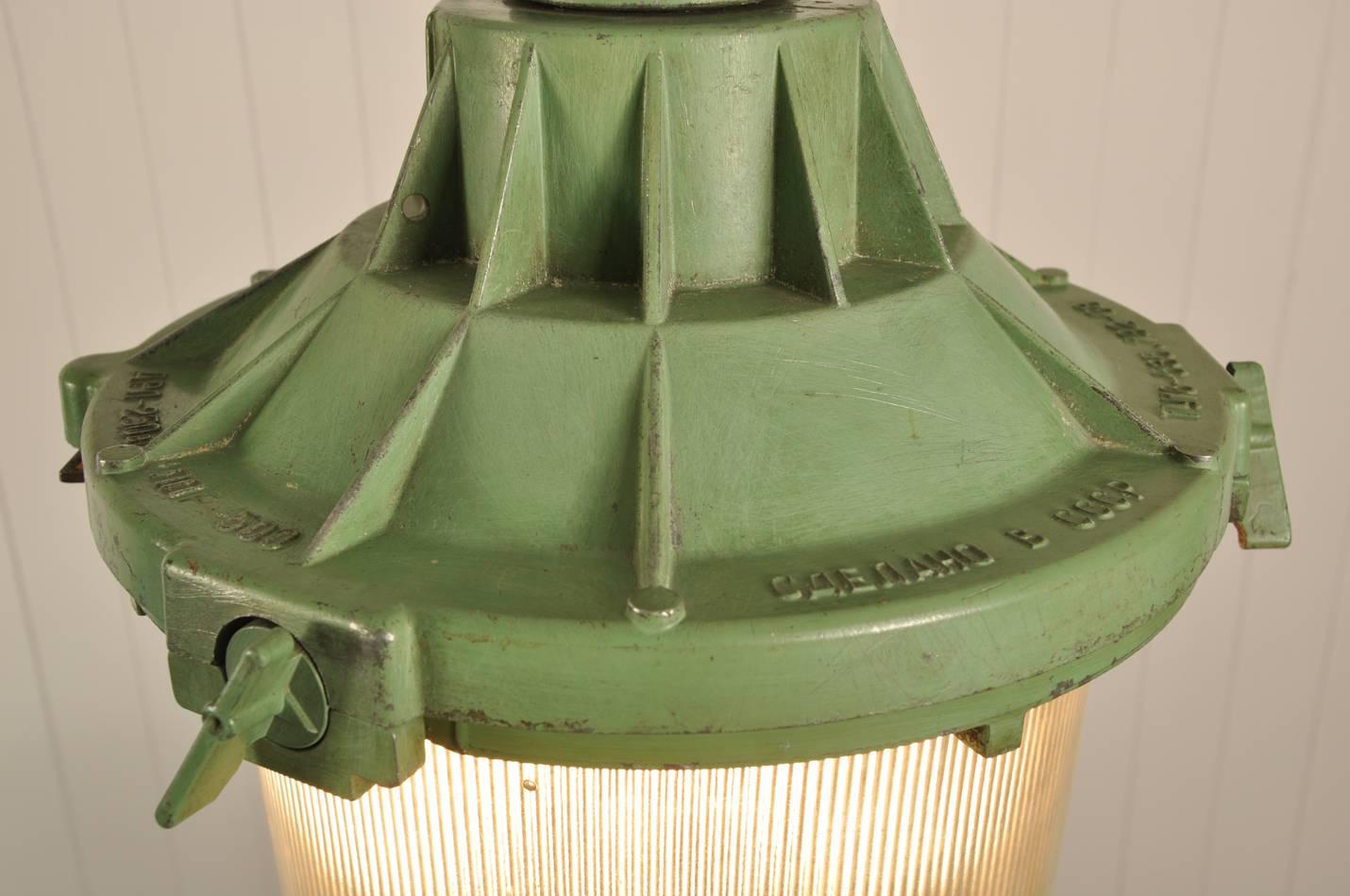 This vintage Industrial prismatic light was sourced from a German copper mine. 

Designed to be explosion proof these lights are very well engineered.

We have kept this one in its original paint and patina and love the impact its scale and