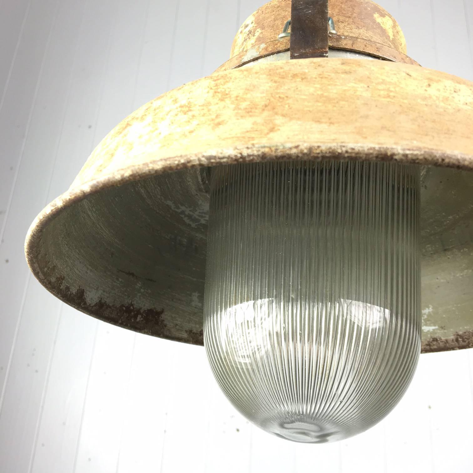 Sourced in France these vintage Industrial lights are very unusual and we have not come across this style before. 

We have not touched the outside of these as we love the patina.

We have replaced the fittings with modern bulb holders and these
