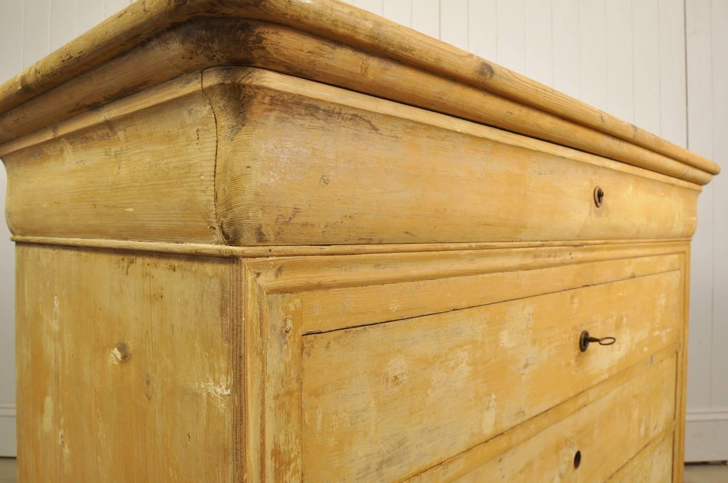 This beautiful antique commode was sourced in Provence. 

Many layers of paint have been 'washed' back to reveal these older colours and produce this great finish and color.

We love the shape and the way the feet and the top drawer have been
