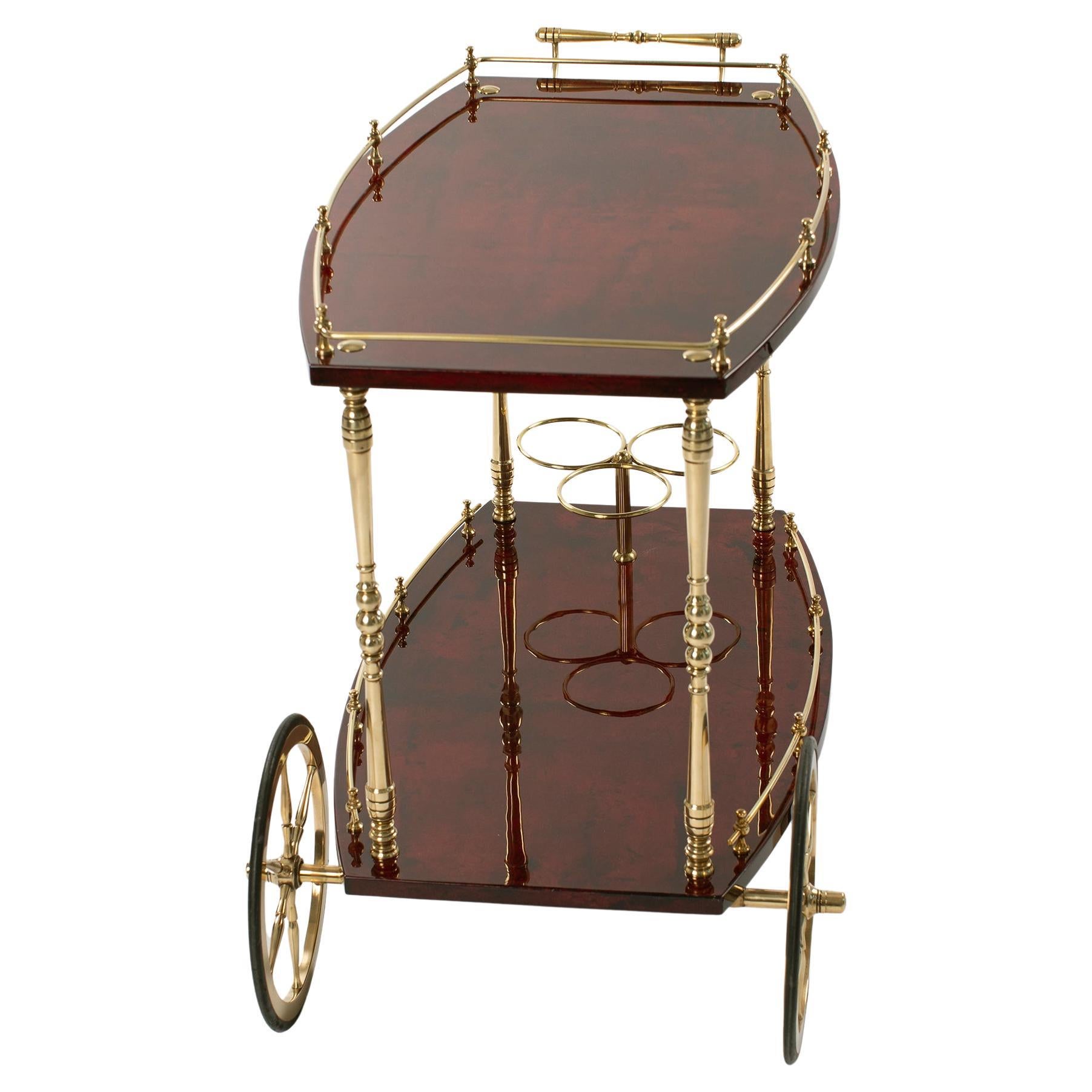 Italian Mid-Century Bar Cart in Dark Red Goatskin and Brass by Aldo Tura 1970s
Exceptional bar cart since both the shape as well as the dark red color make the object an eye-catcher. 
The bar car was completely restored.
That means, completely