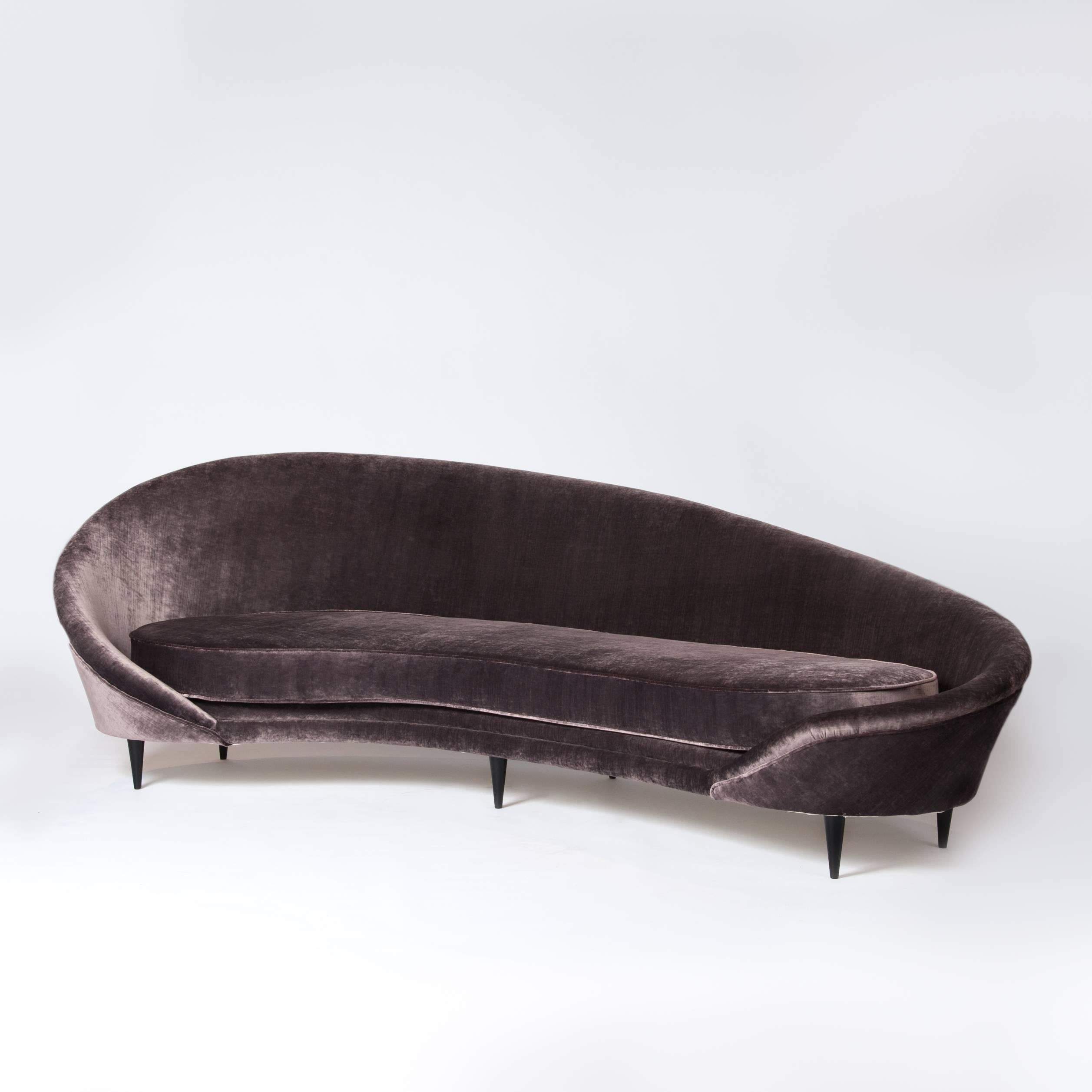 Grande Divano Curvo
Wonderful organic and elegant shaped sofa by Federico Munari.
The object is gently curved; the new upholstery with a cover fabric (viscose velvet color mauve) from Rubelli emphasizes the design.
Please take notice of the seamless