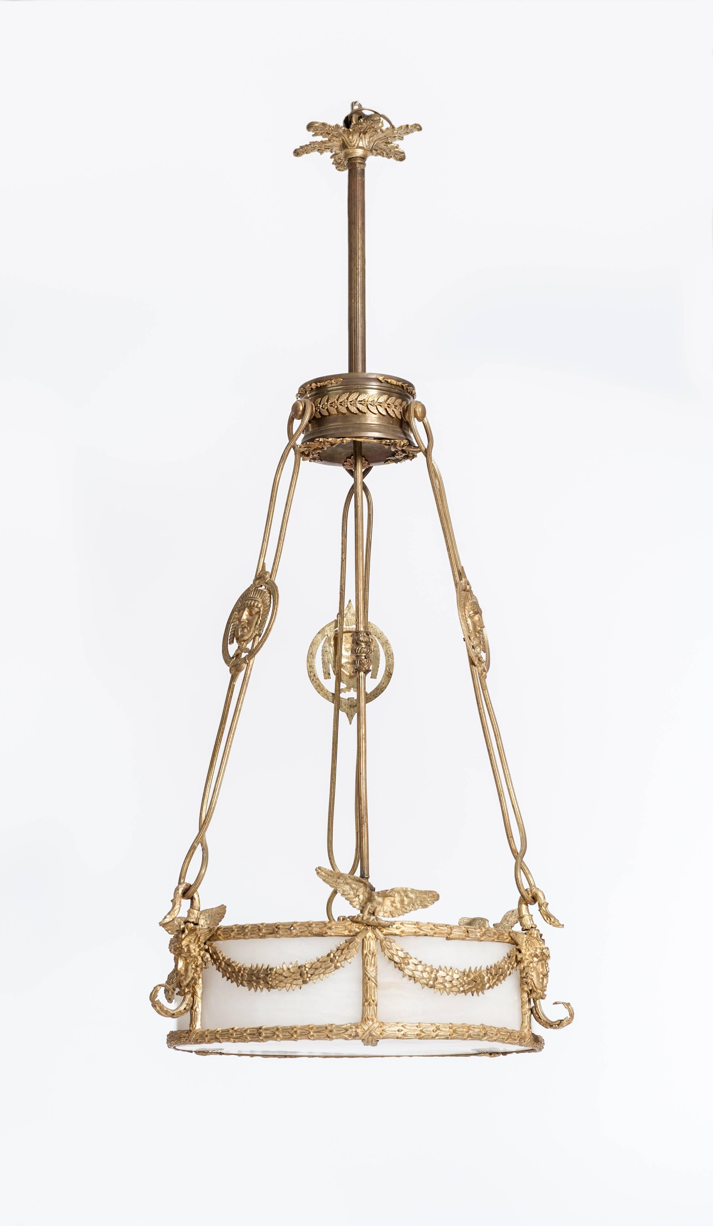 Impressive fire-gilded Empire chandelier with very fine imperial and classicist ornaments, which are
shade is made of alabaster,
The lamp body is framed by a surrounding leaf frieze, also the vertical subdivision of the shade is decorated by this