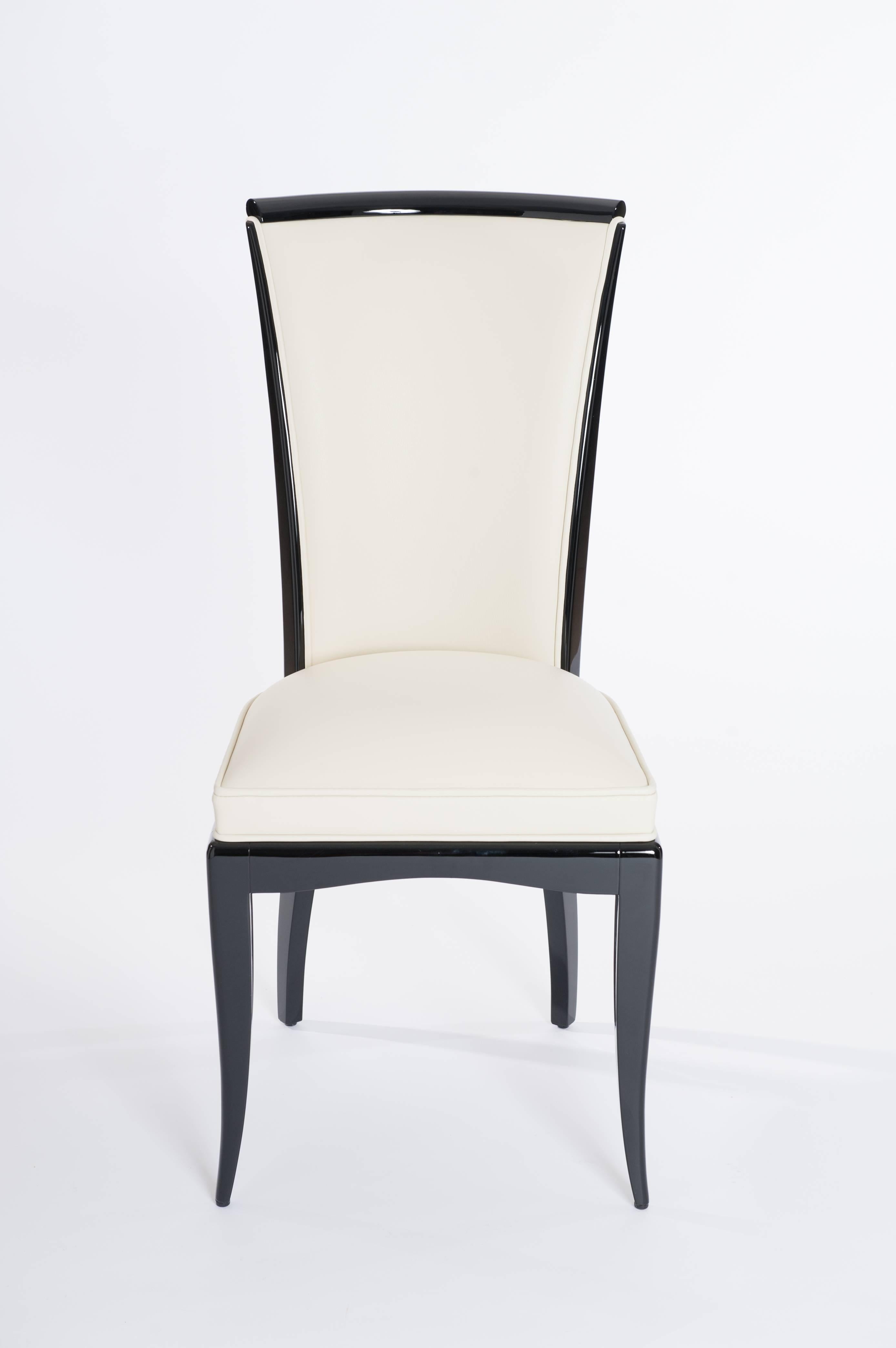 Elegant and graceful shaped Art Deco dining room chairs with high backrest.
Re-lacquered wooden frame and complete new re-upholstery - 
cover fabric 100% leather color off-white.