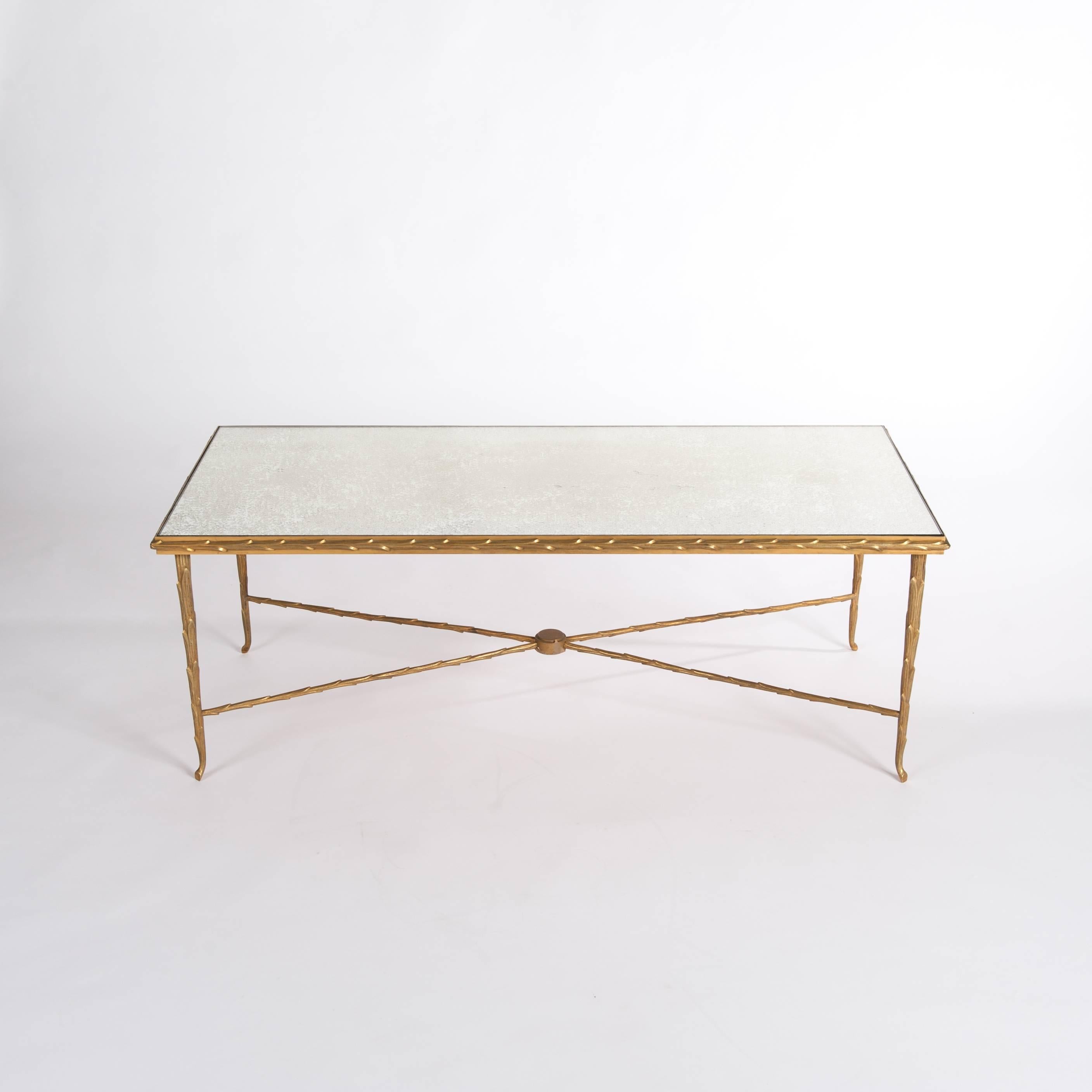 Rectangular bronze - gilt sofa table attributed to Maison Jansen, circa 1970.
It stands out thanks to the amazing detail it was crafted with.
The very fine workmanship presenting recurring palmier decoration gives the
table an especially luxurious