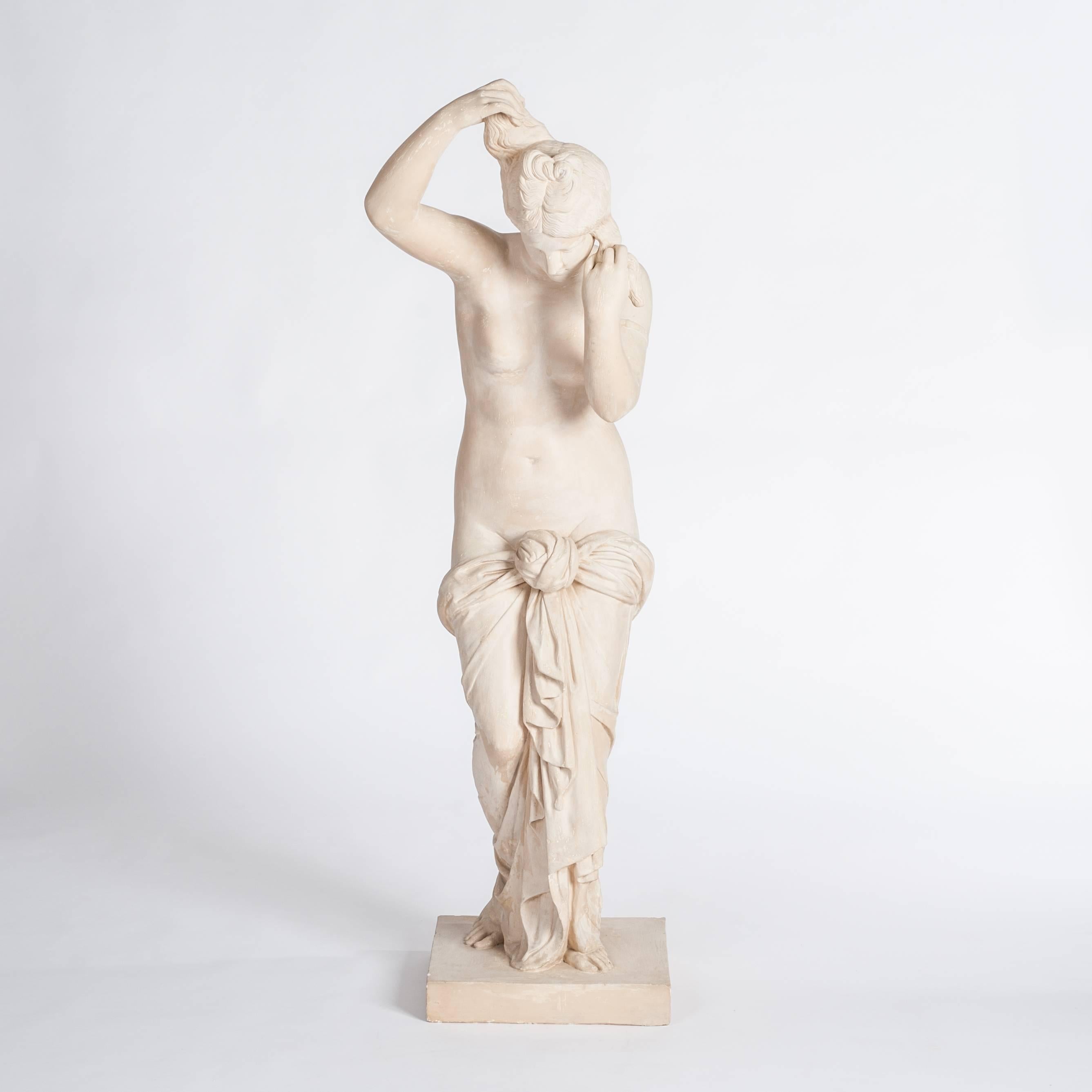 Lifesize sculpture of a classical woman (idealized presentation) constructed
by plaster of Paris, based on a square socle of 7.5cm, stamped.
The surface is slightly patinated, perfect condition.