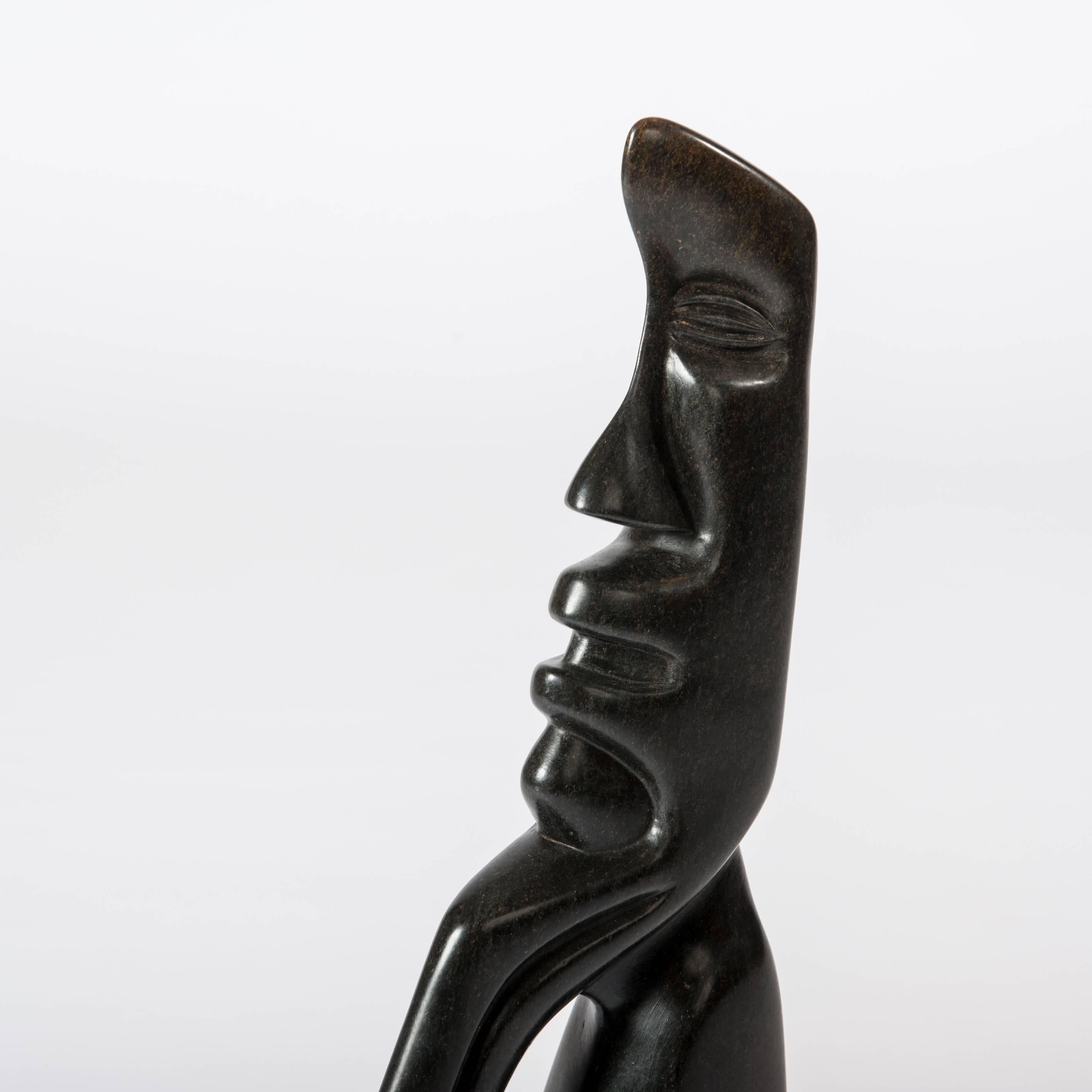 Cubistic shaped African figural black springstone sculpture by Bauden Khoreay on acryl socket.
Measurements sculpture: 37cm x 5.6cm x 52.5cm
Measurement acryl base: 30cm x 10cm x 2.5cm

Biography:
Born in 1948 in Cholo, Malawi.
Alongside