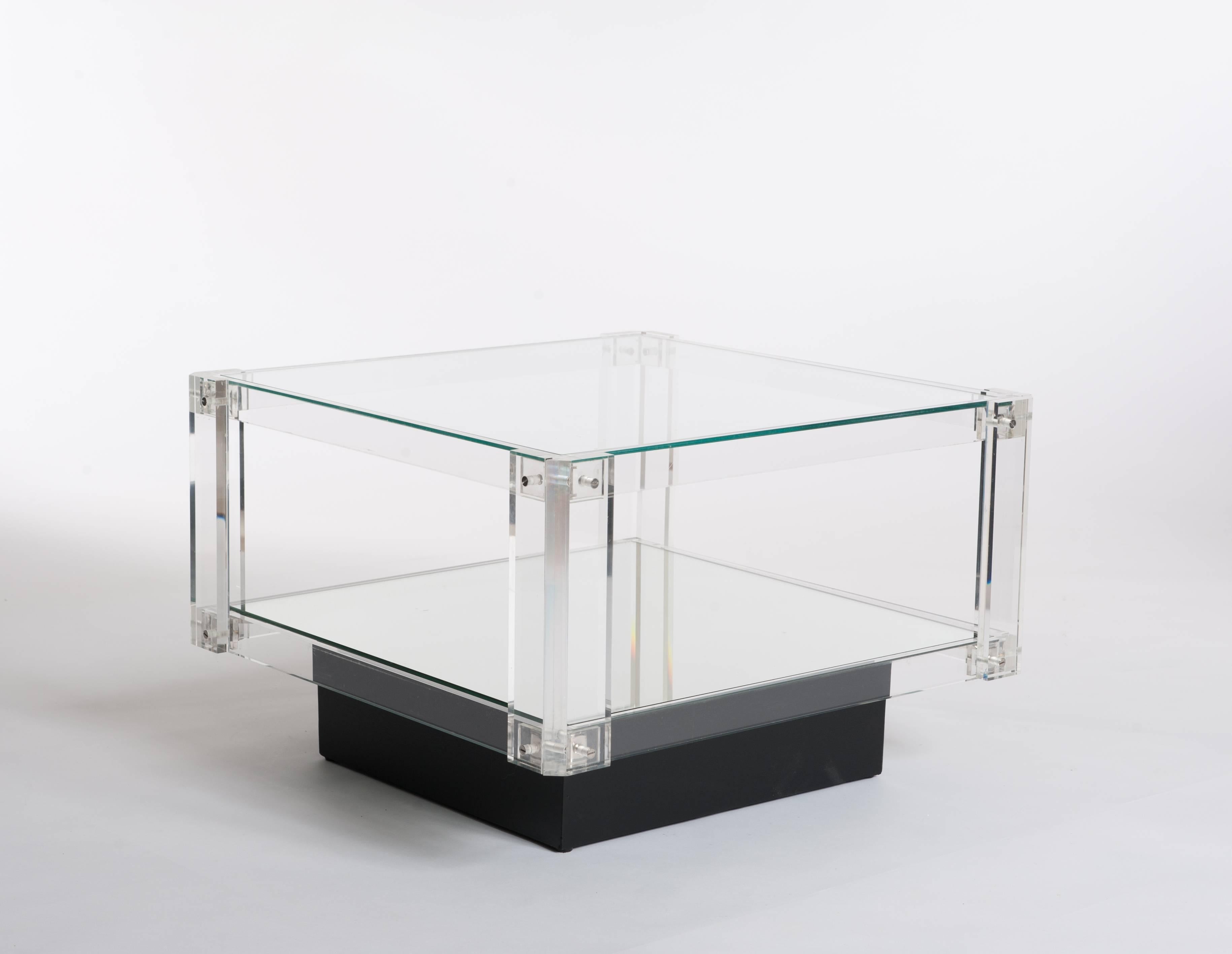 Cubistic shaped pair of side tables made out of different materials.
The frame is made out of acrylic glass combined with glass top, mirrored base
on wooden black socle.
Typical pure Scandinavian design.
Size of socle: 41cm x 41cm x 12cm.