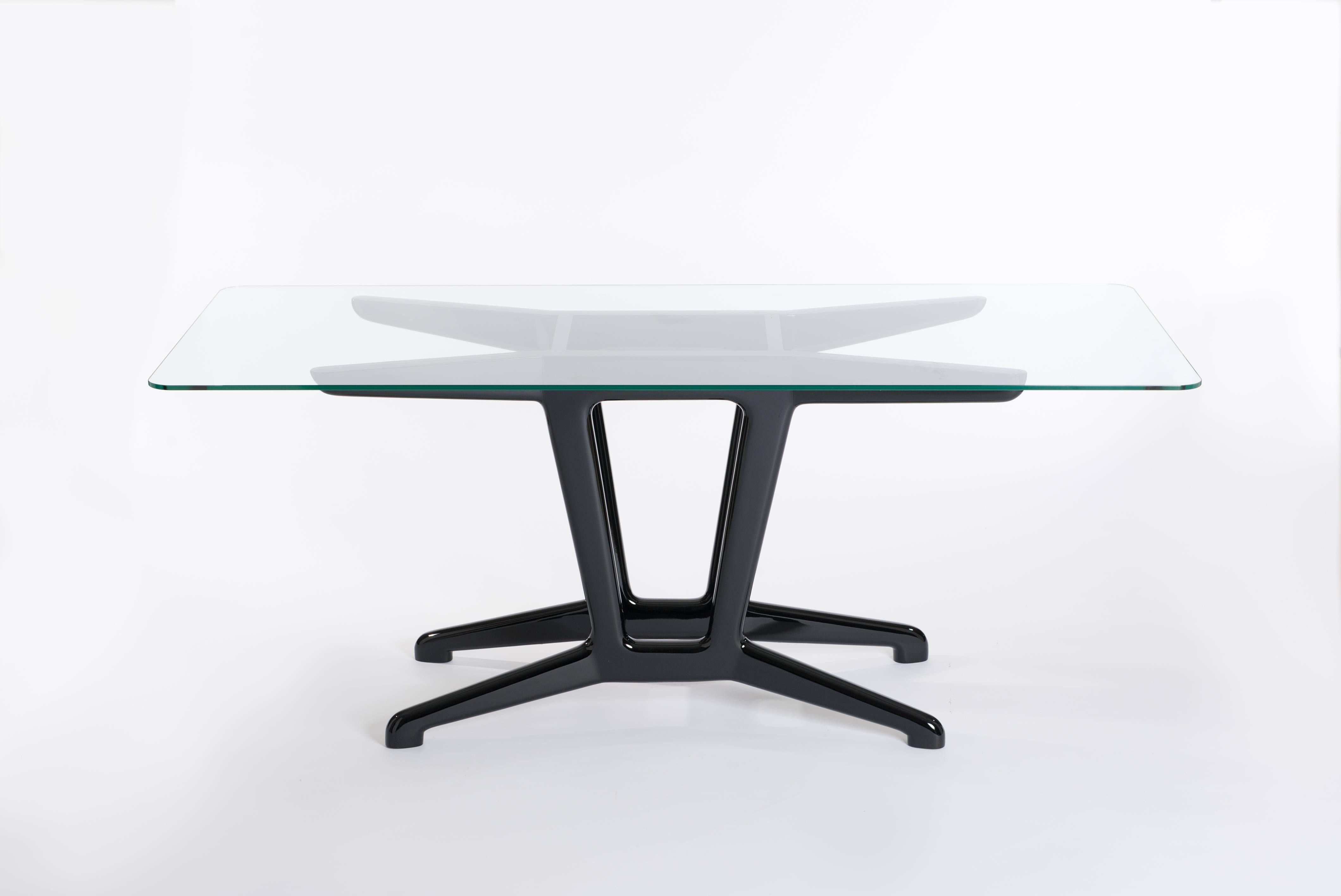 Midcentury Italian, elegant dining table or desk with re-lacquered wooden base black colored - glass top (1cm thickness) with rounded edges.
The fleet footed base construction and the non-edges glass top gives an organic impression.
On demand we