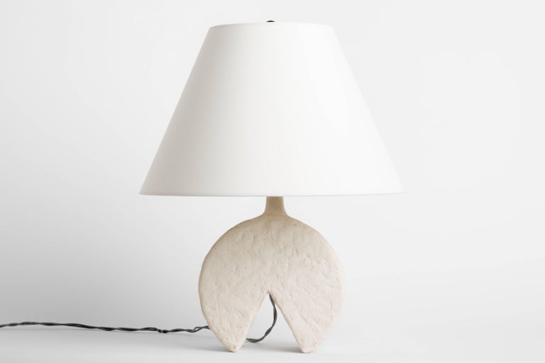 The Dado lamp is 1 of 5 resin lamps of Dolatowski's cast lamp series. This resin lamp is organic, modeled and textured in finish and geometric in form. 

Wired to US standards. Shade not included. 

Influenced by his travels in Asia and the Middle