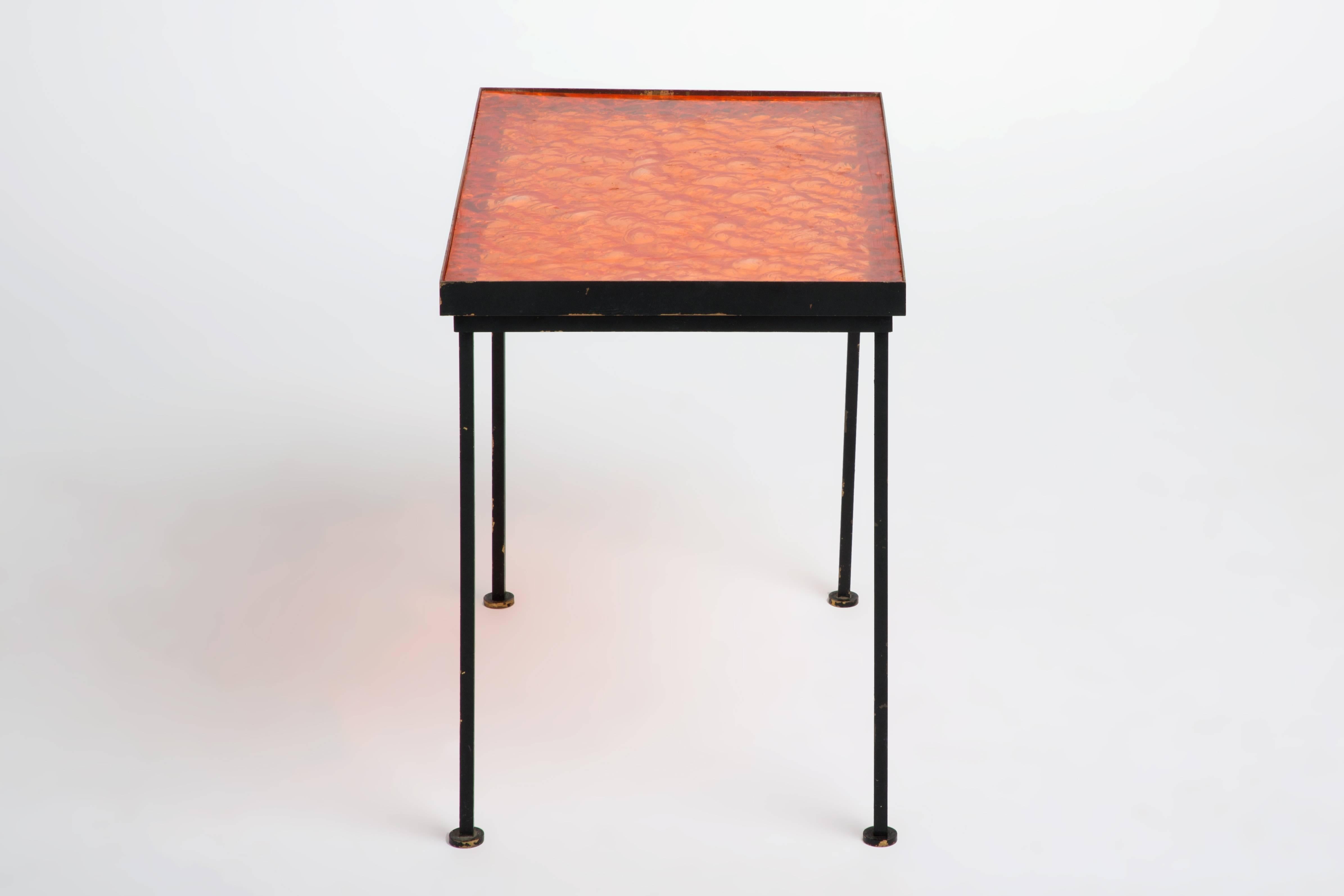 This side table is in excellent condition with a beautifully crafted orange resin top.