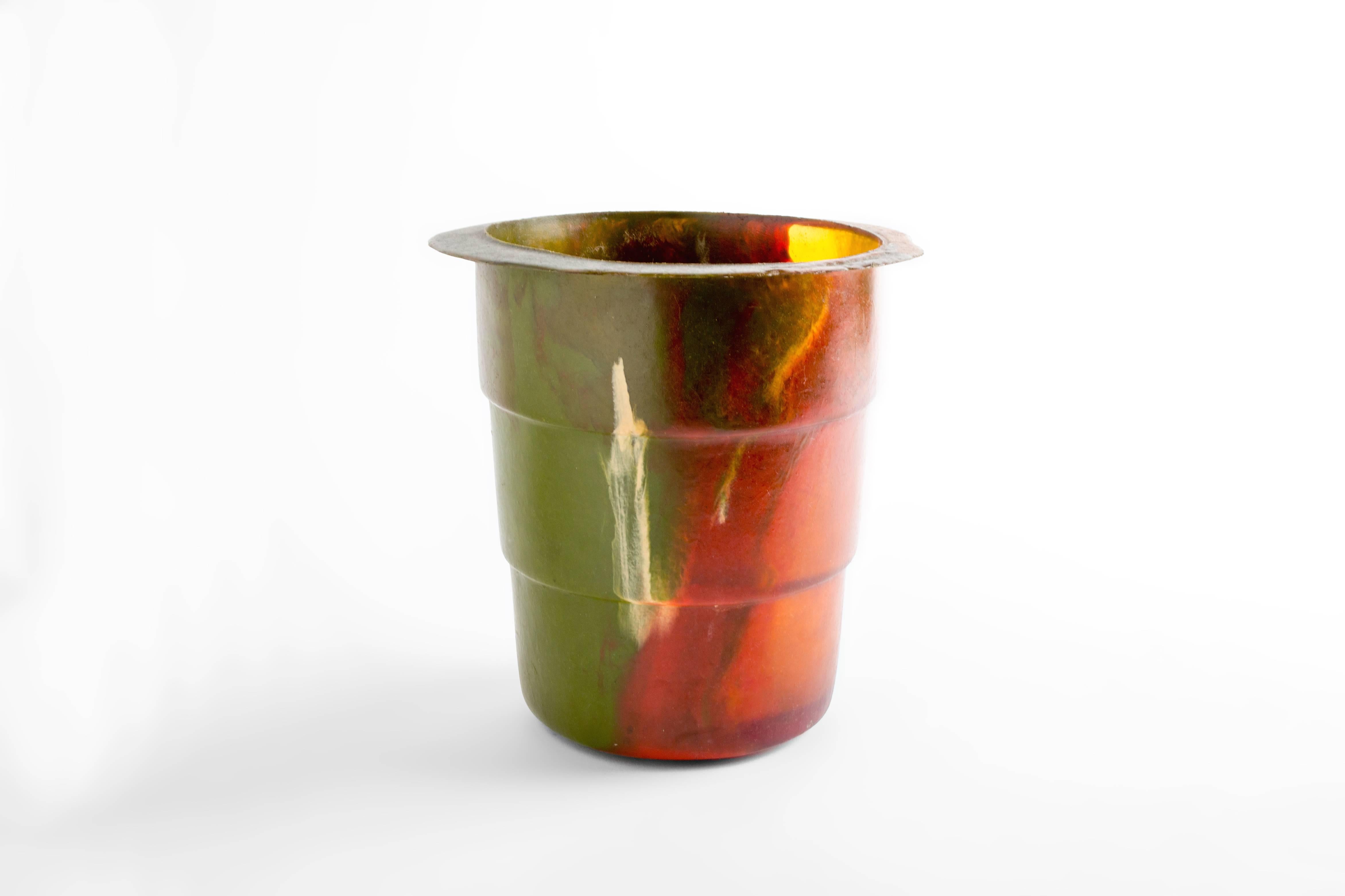 Multicolored resin bucket by Italian architect and leading figure in contemporary Industrial Design Gaetano Pesce. Born in La Spezia, Italy in 1939, Pesce has spent his career as an architect, urban planner and Industrial designer. His use of color