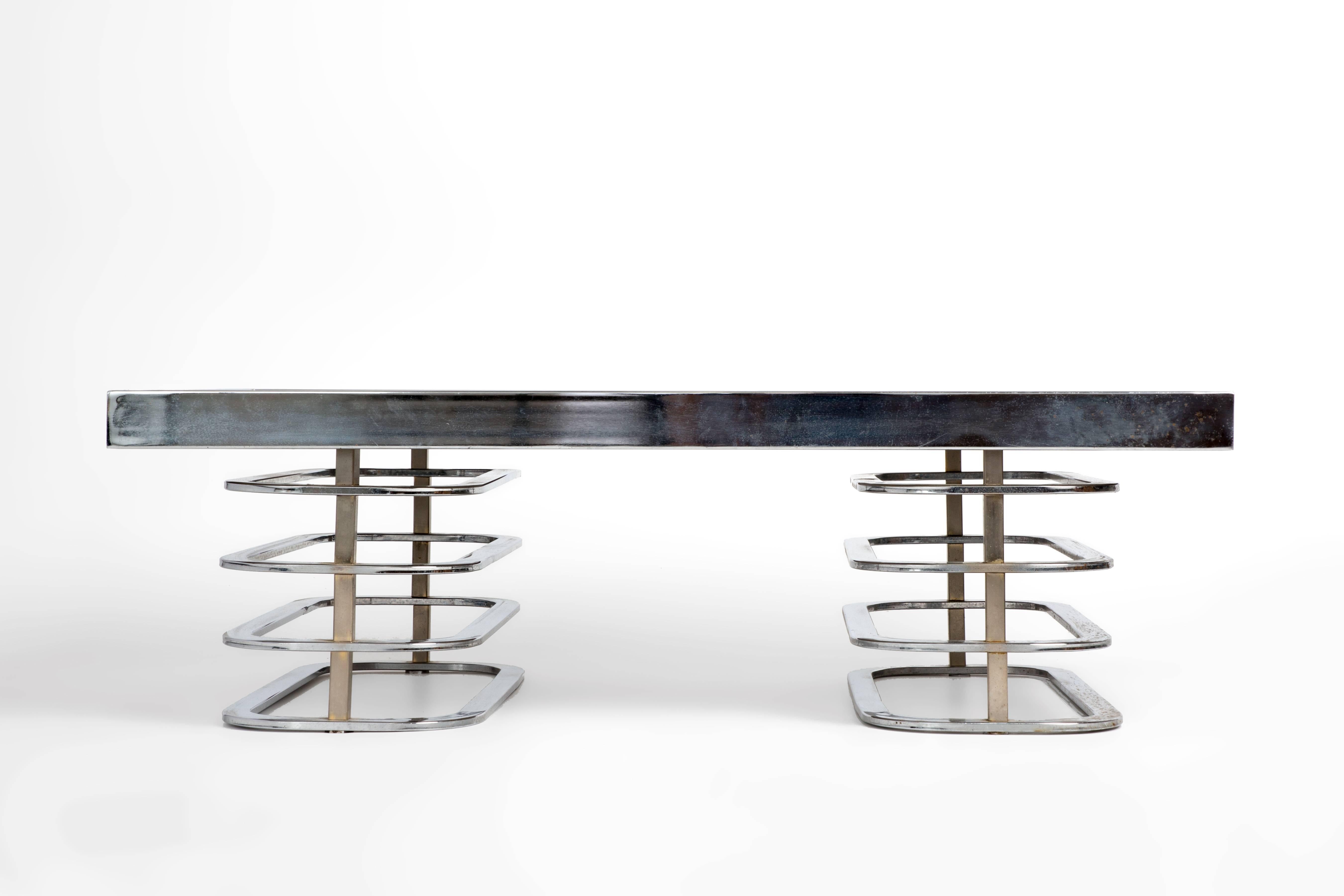 This unique coffee table has a modeled metallic backed-glass top. 

 