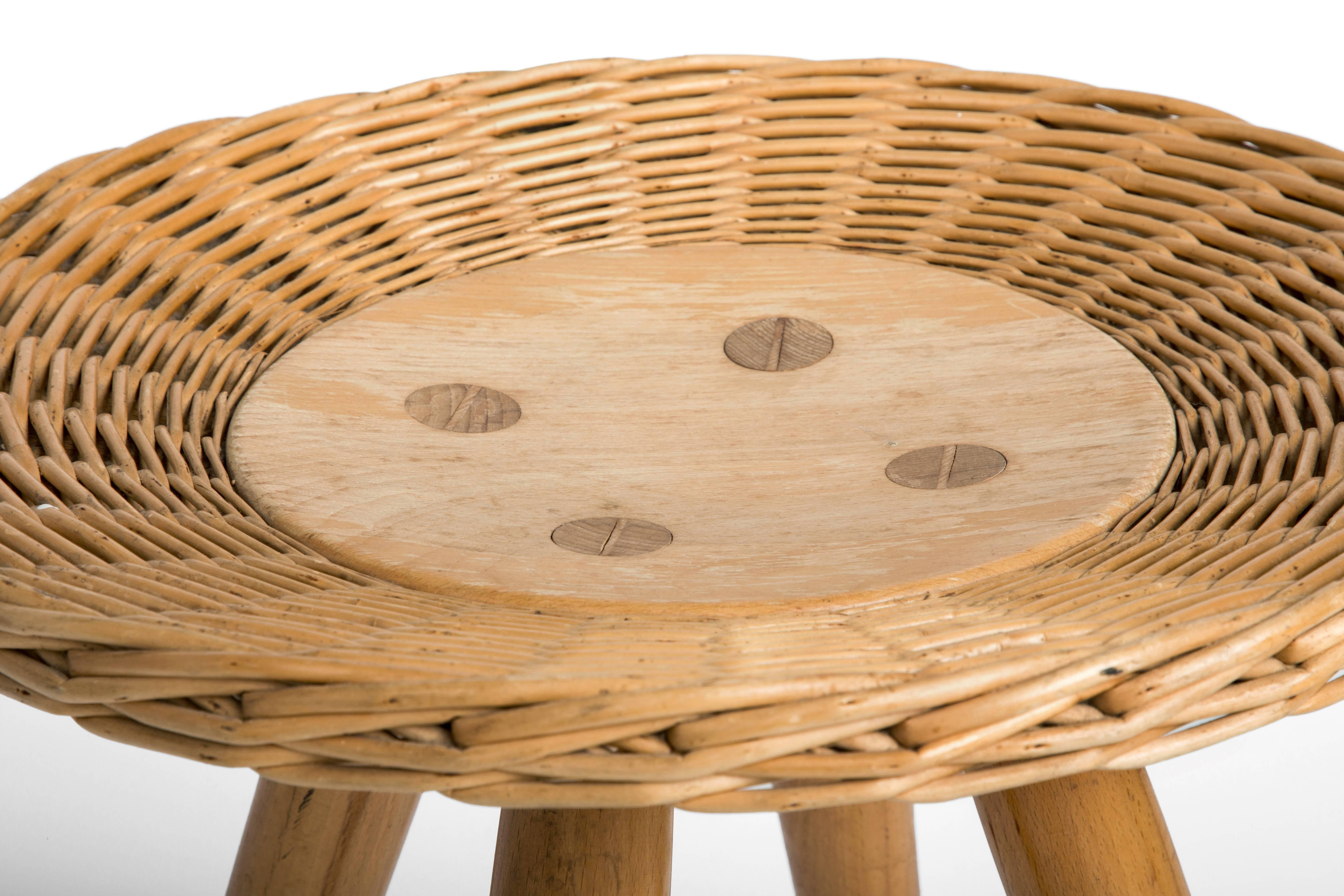 The seat is surrounded by a basket weave border with through tenons in a button pattern.