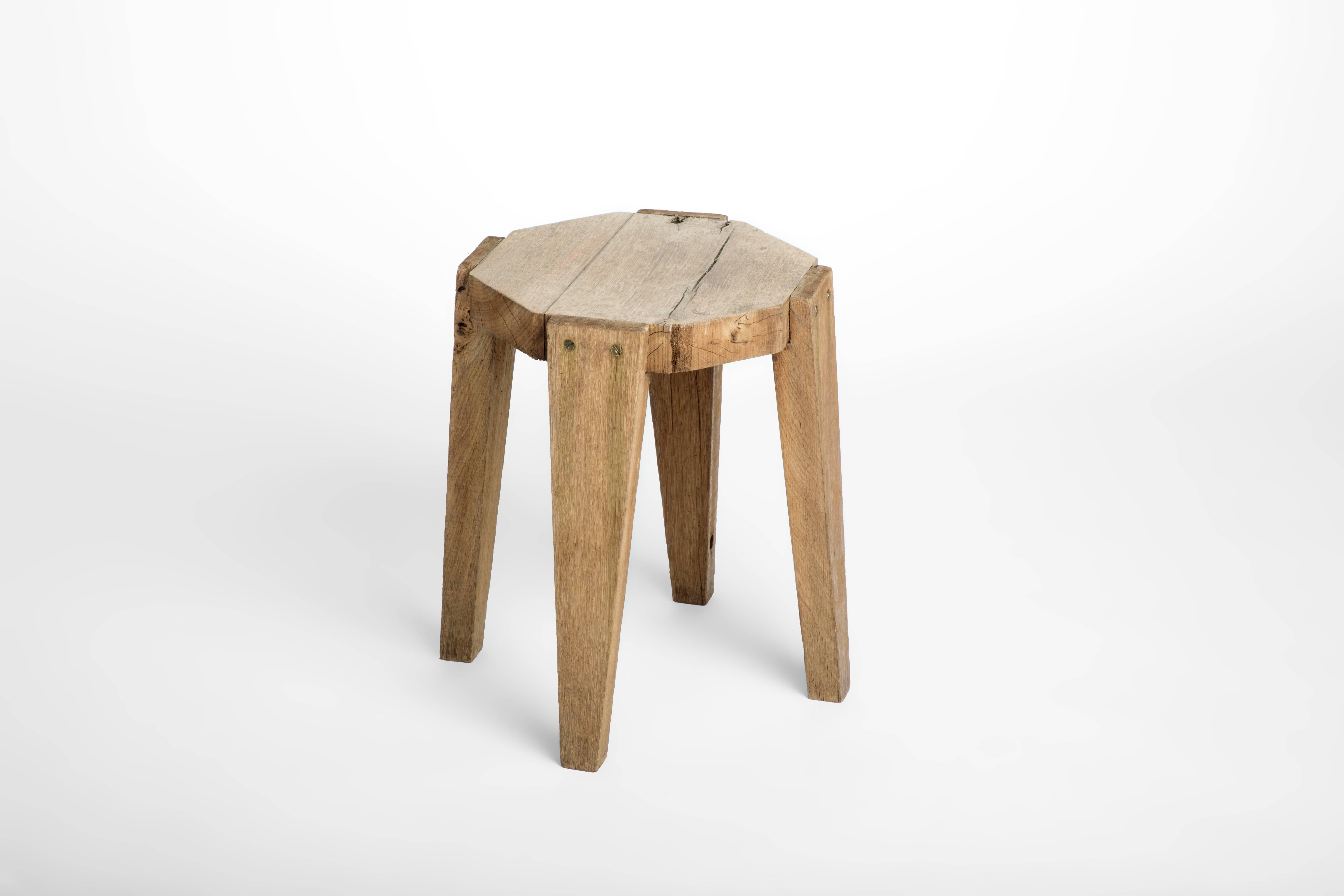 A light colored oak stool in very stable condition. This piece could double as a side table. 