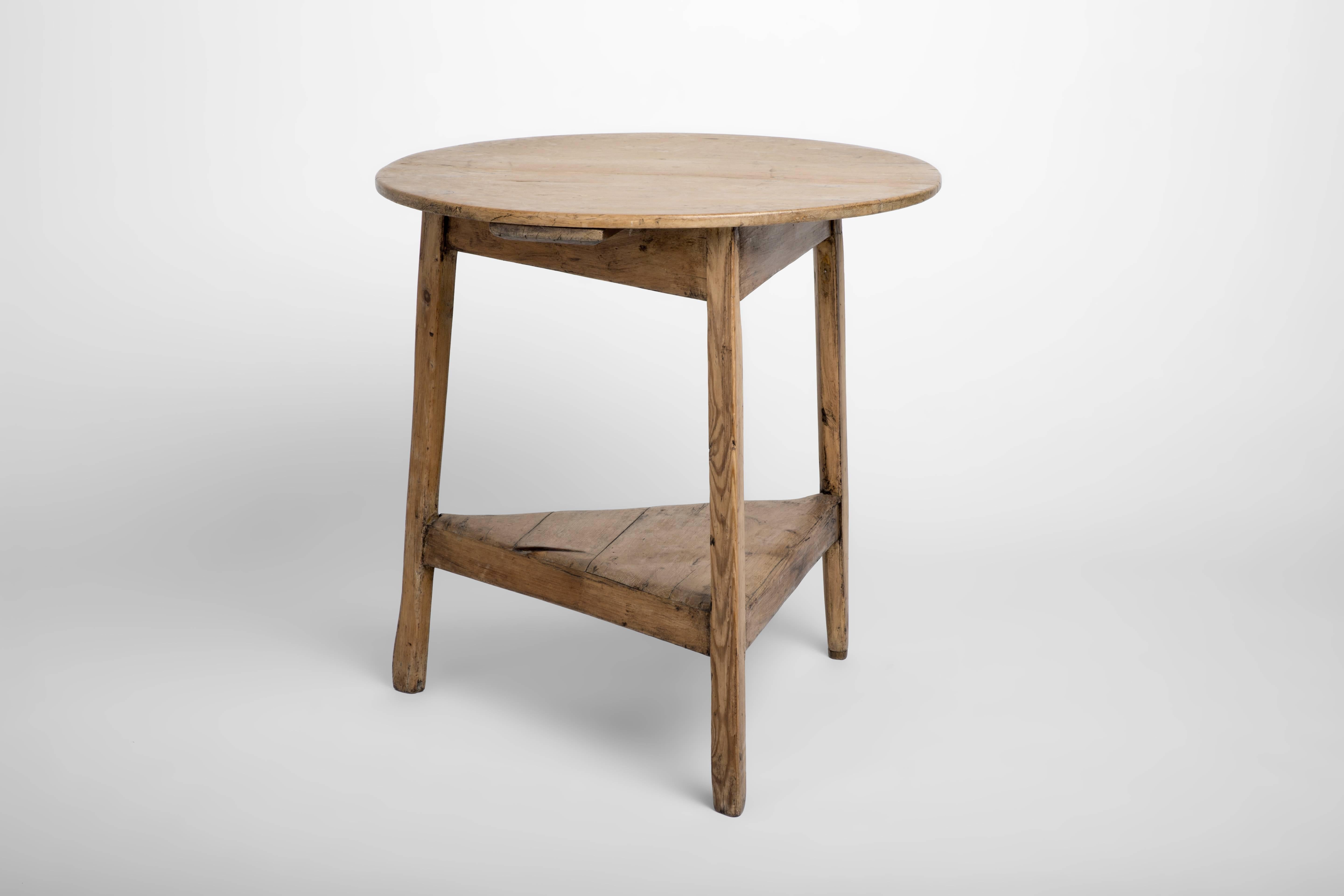 Vintage 19th century English cricket table standing on three legs with tray bottom. Cricket tables always had three legs to enhance stability on uneven ground and the bottom tray was to keep the beer out of the sun while the game was played.