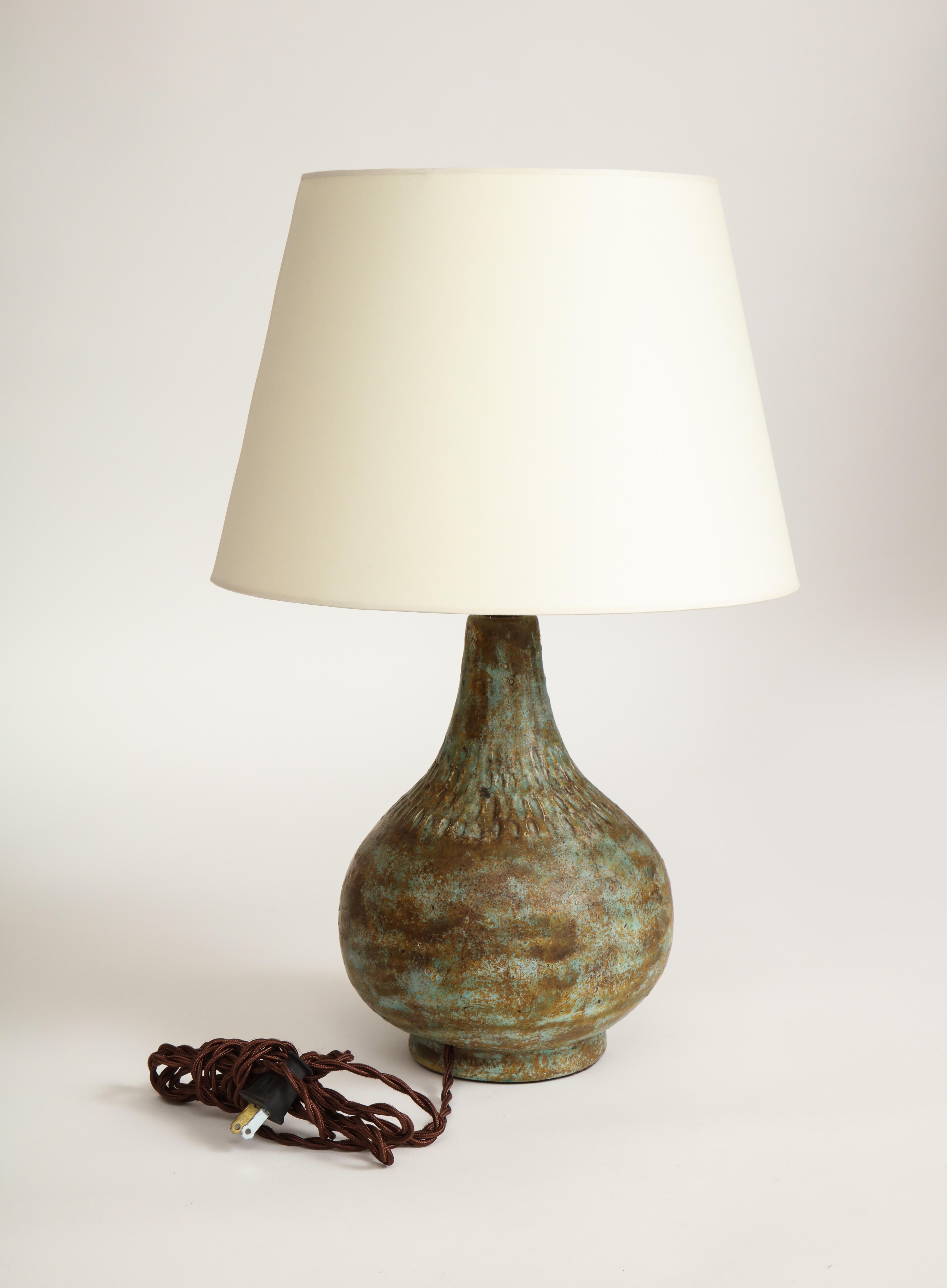 Vintage ceramic lamp with unique coloring and texture. 

Wired to US standards. Shade not included.