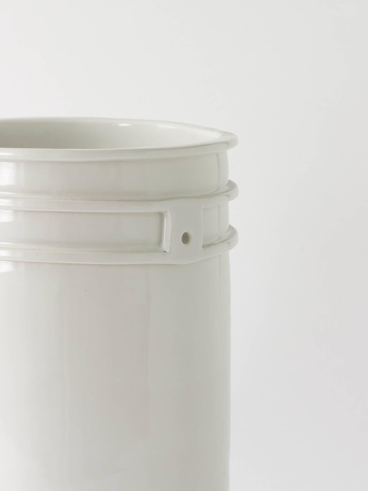 This white porcelain bucket by Matthias Merkel Hess is dated and marked with a unique pattern on the underside.

The bucket measures 11.5” diameter by 15.25” high.

Sculptor, potter, maker, manufacturer and merchandiser, Matthias Merkel Hess
