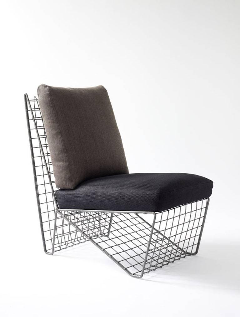 Metal frame and upholstered cushion chair. 

Includes cushions upholstered as shown in images, in good condition. 