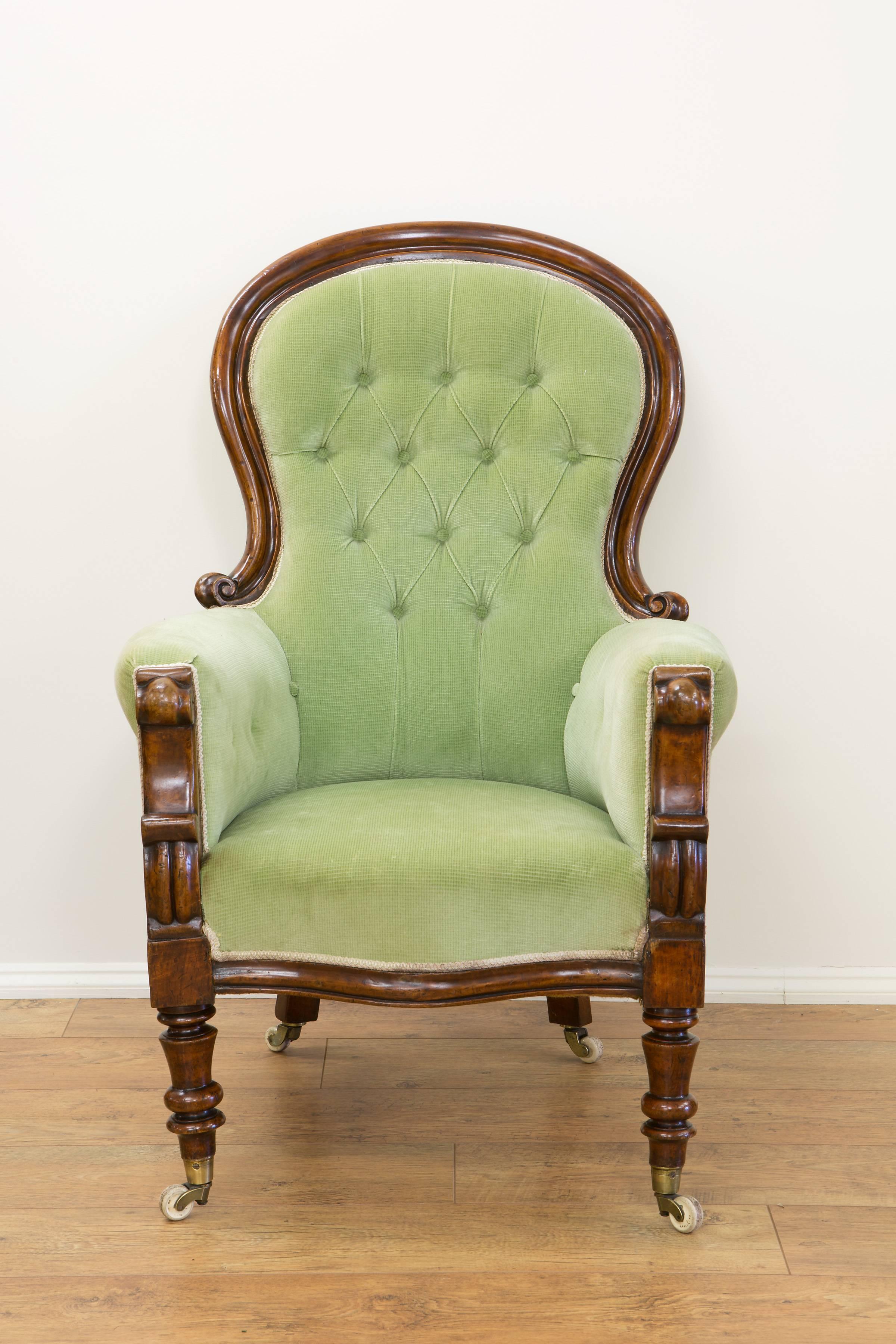 Early Victorian mahogany spoon back, show frame chair with carved decoration resting on original castors, circa 1840.