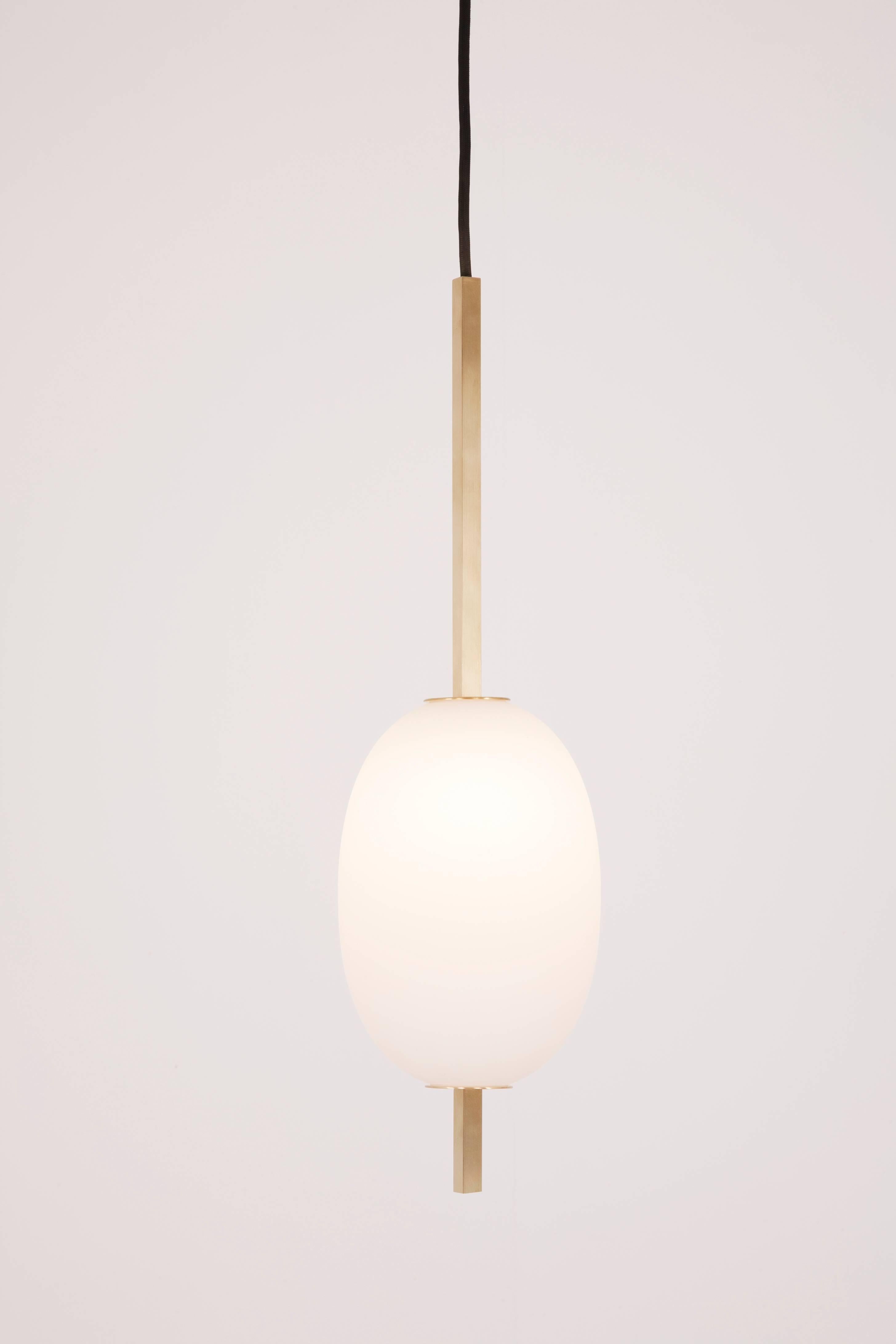 The Miro 1 pendants are made of a brass square stock. Finish options are satin brass or matte black. The Miro glass shades are handblown, sand blasted and oiled. The wire is black cloth covered and can be ordered to a custom length.

Round pendant: