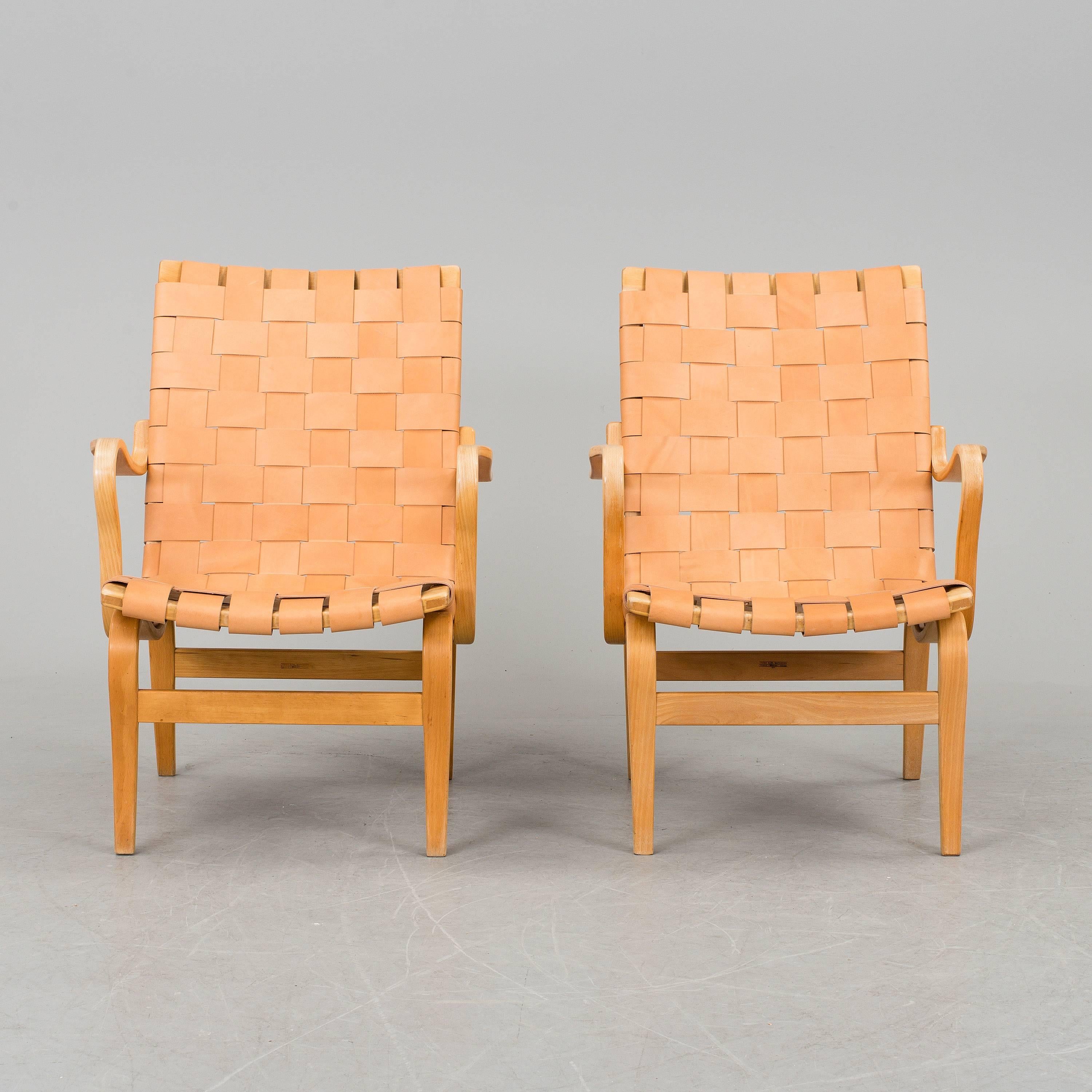 A beautiful pair of 'Eva' armchairs with leather by Bruno Mathsson for Firma Karl Mathsson, Värnamo.
  