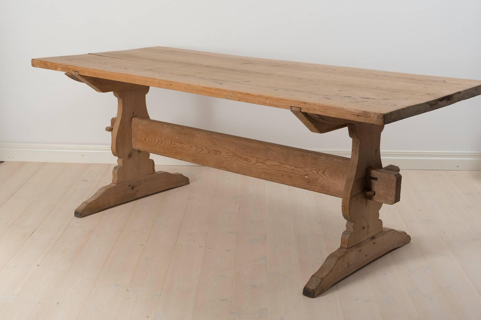 Trestle table from norther Sweden. Solid, thick tabletop (4 cm) in pine. Nice, untouched original patina. The table has never been painted. Sweden, circa 1780.