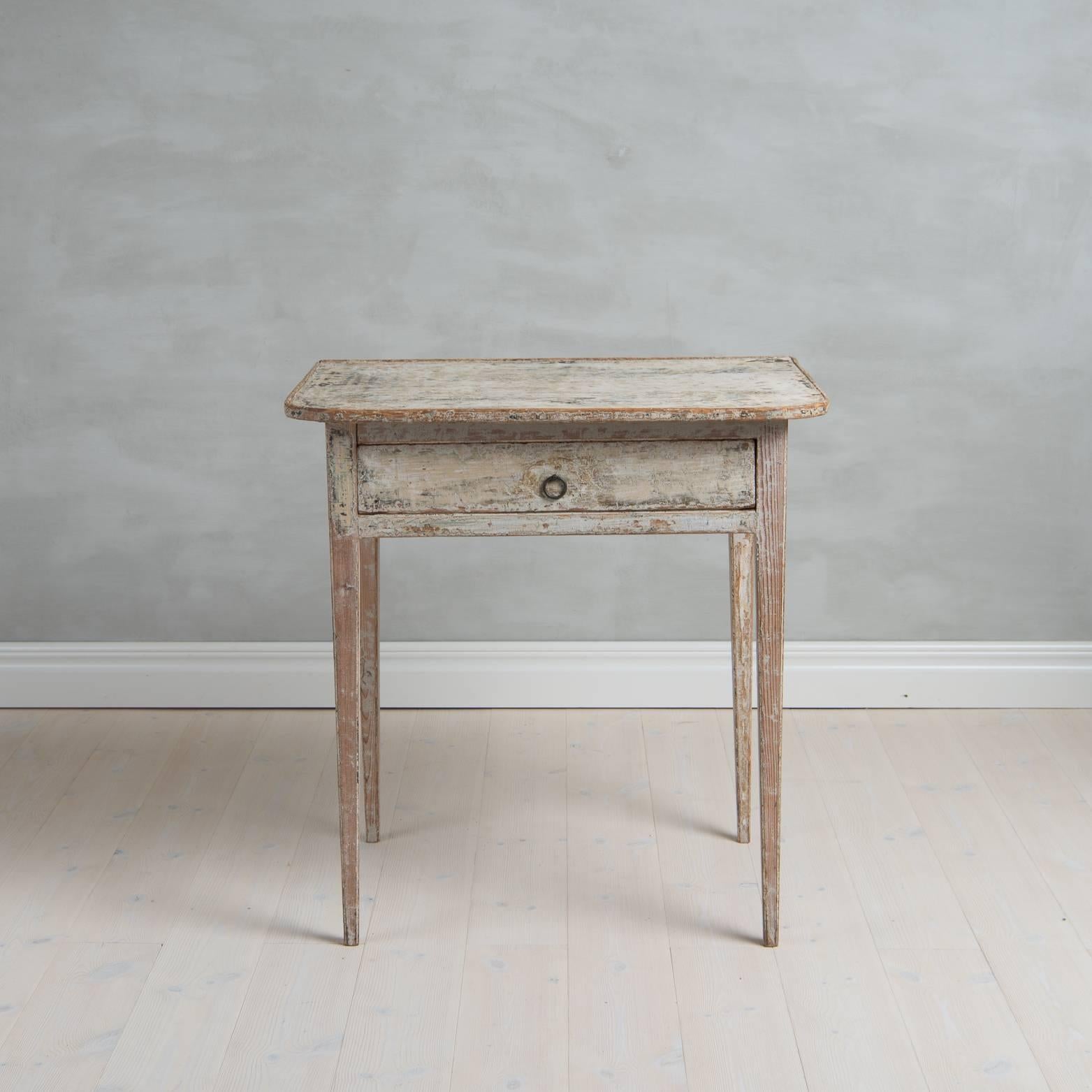 Paintied Gustavian side table with tapered legs and a drawer. The front edge of the top has rounded corners. The table is dry scraped to original paint. From Northern Sweden.