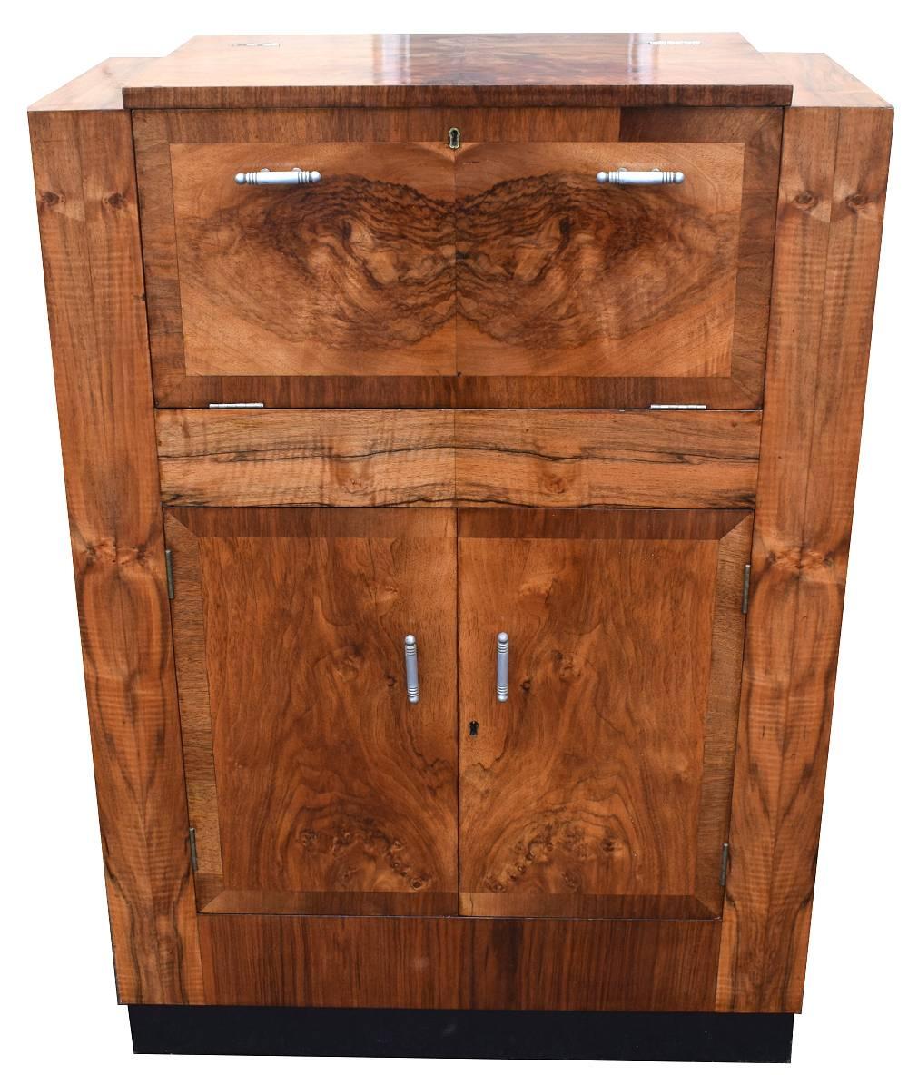 Art Deco Fitted Burr Walnut Cocktail Cabinet

This hugely stylish cocktail cabinet, titled Hospitality Cabinet, is a fantastic piece of Art Deco furniture, and it's internal fittings prove to be an incredibly appealing feature.
The beautifully