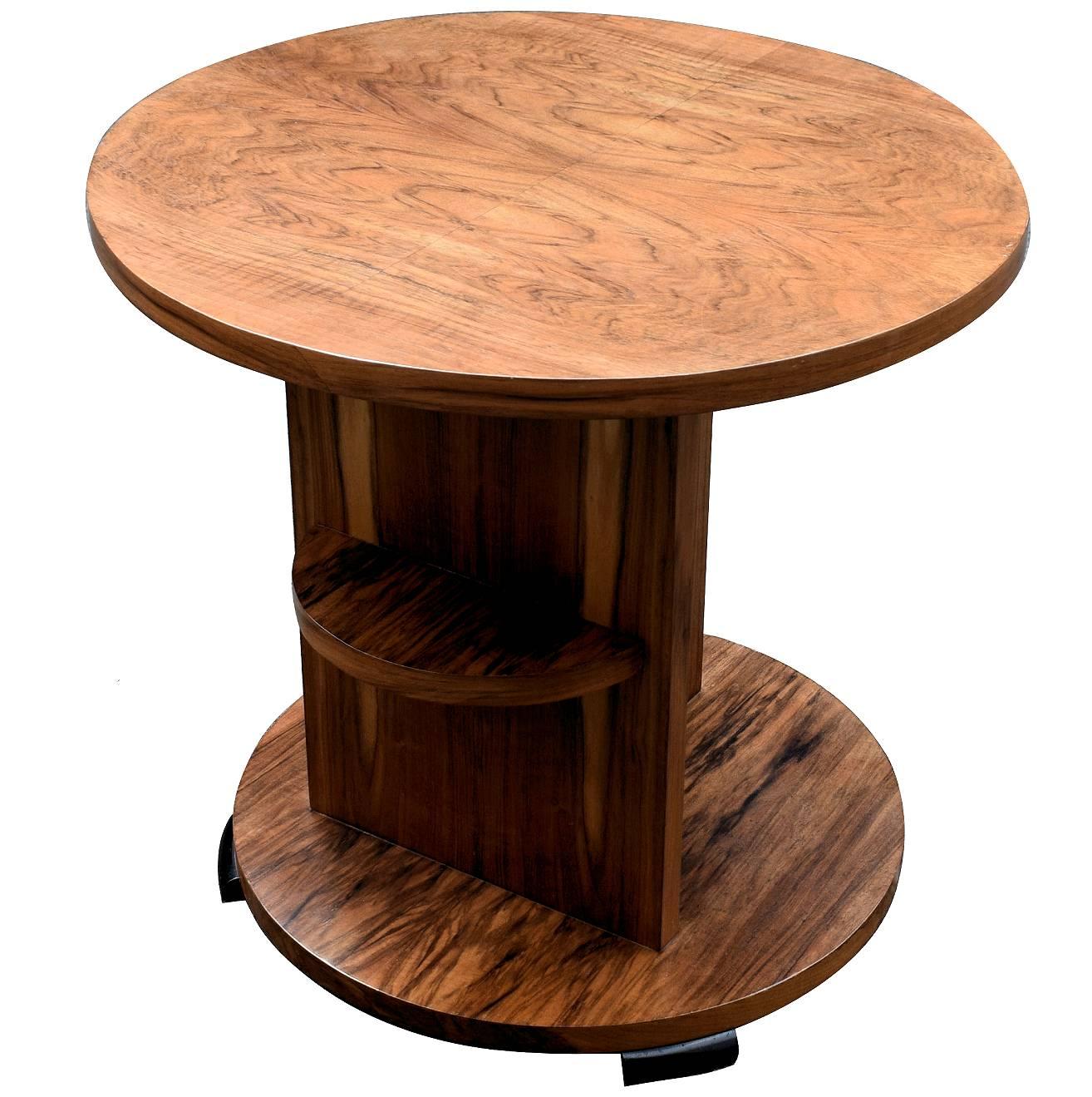 Very stylish Art Deco English modernist table dating to the 1930s. A very fine example that can be used for multiple purposes, a center, end, coffee table. Fabulous quality with figured walnut veneers throughout. A central sectional column really