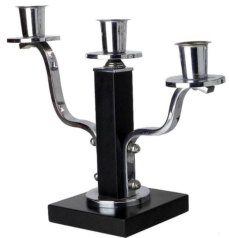 Modernist Art Deco pair of matching candelabra in lacquered ebonized wood and chromed metal. Dating to the 1930s and originating from Belgium.
The condition of the chromium is excellent as is the black wood.
  