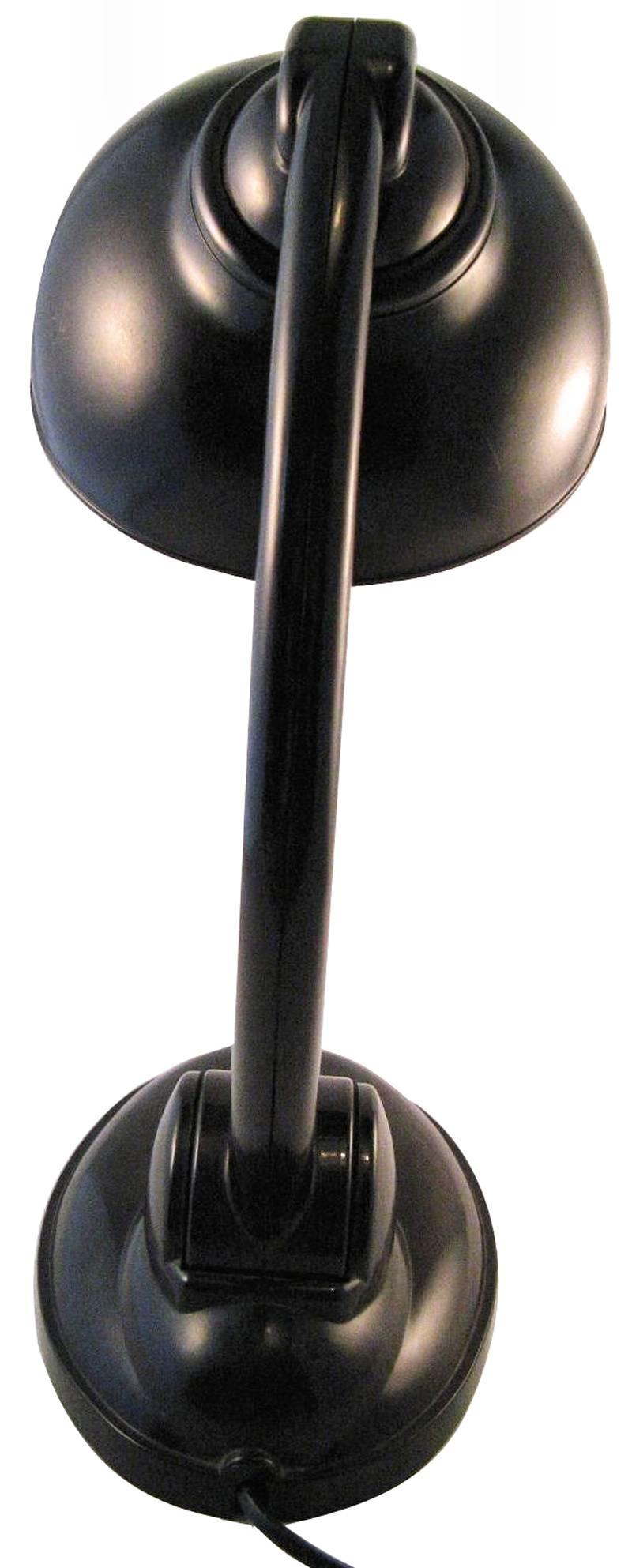 A stunning example of Eric Kirkman Cole's Art Deco stylish table lamp in superb brown bakelite. A model designed in the 1930s and produced in European countries under License. The shade is mounted to a shoulder joint and can be adjusted in all