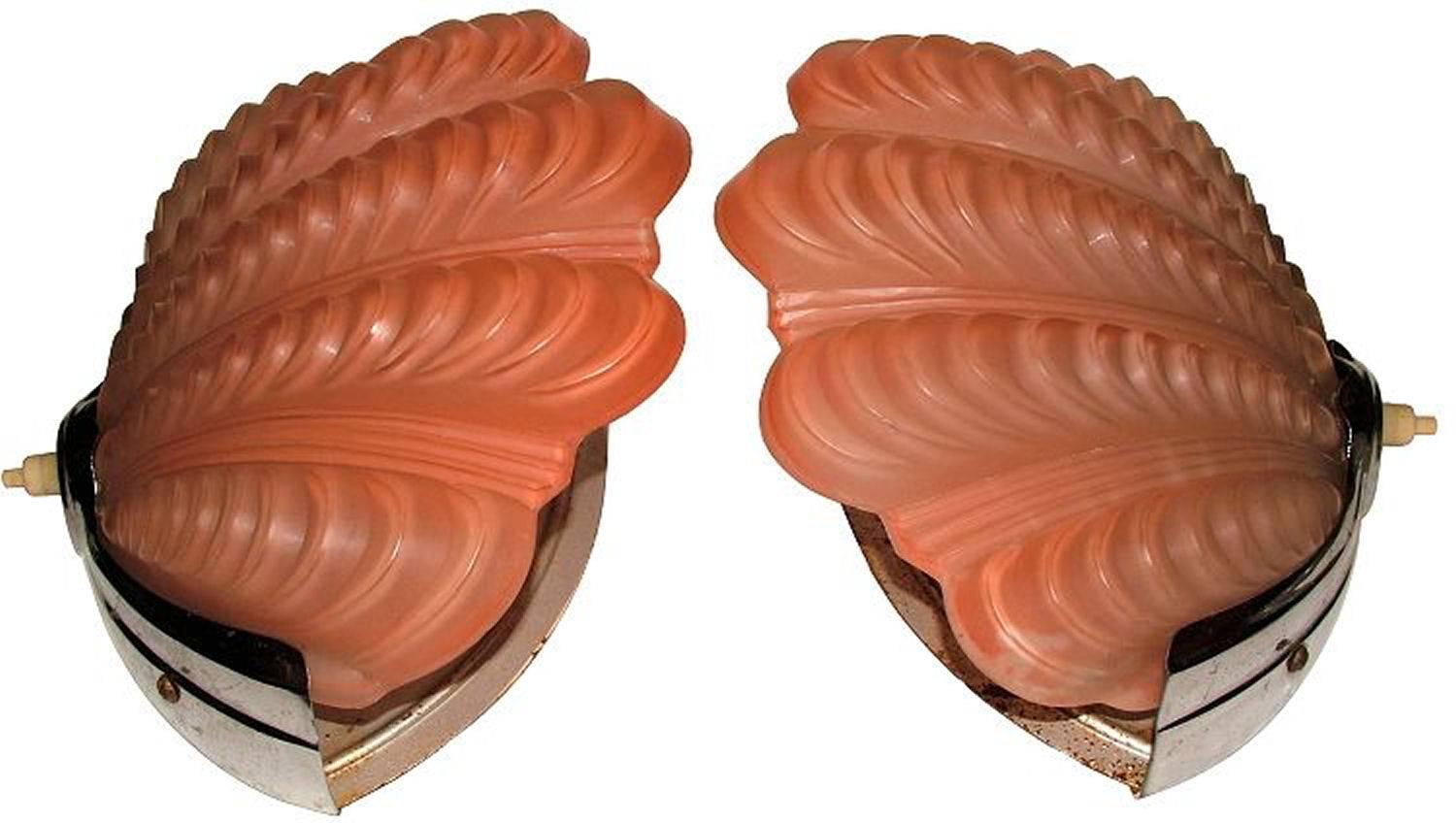A truly beautiful pair of Art Deco Wall Lights of shell form. These gorgeous wall lights have a typical chrome frame surround in original, very good, condition. These hold the beautiful shades firmly in place. These shells are a gorgeous shade of