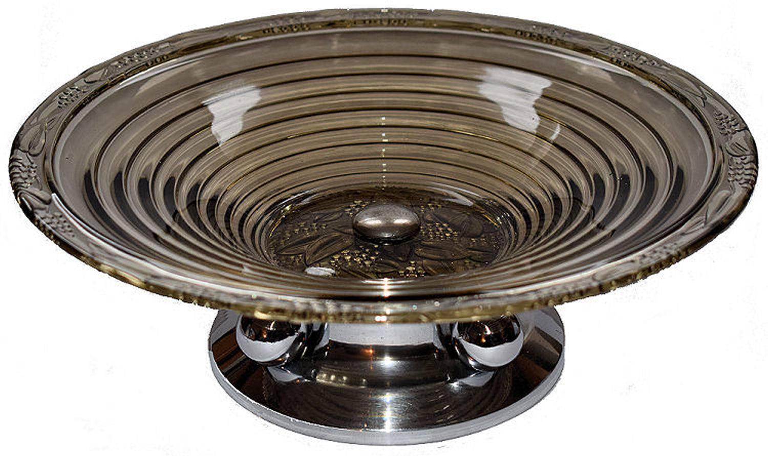 Fabulous French modernist Art Deco glass centre piece coupe fruit bowl. Beautiful design and perfect for your table. These nice deco pieces are getting hard to find. Features a smoke glass bowl supported on a chrome stylised pedestal.