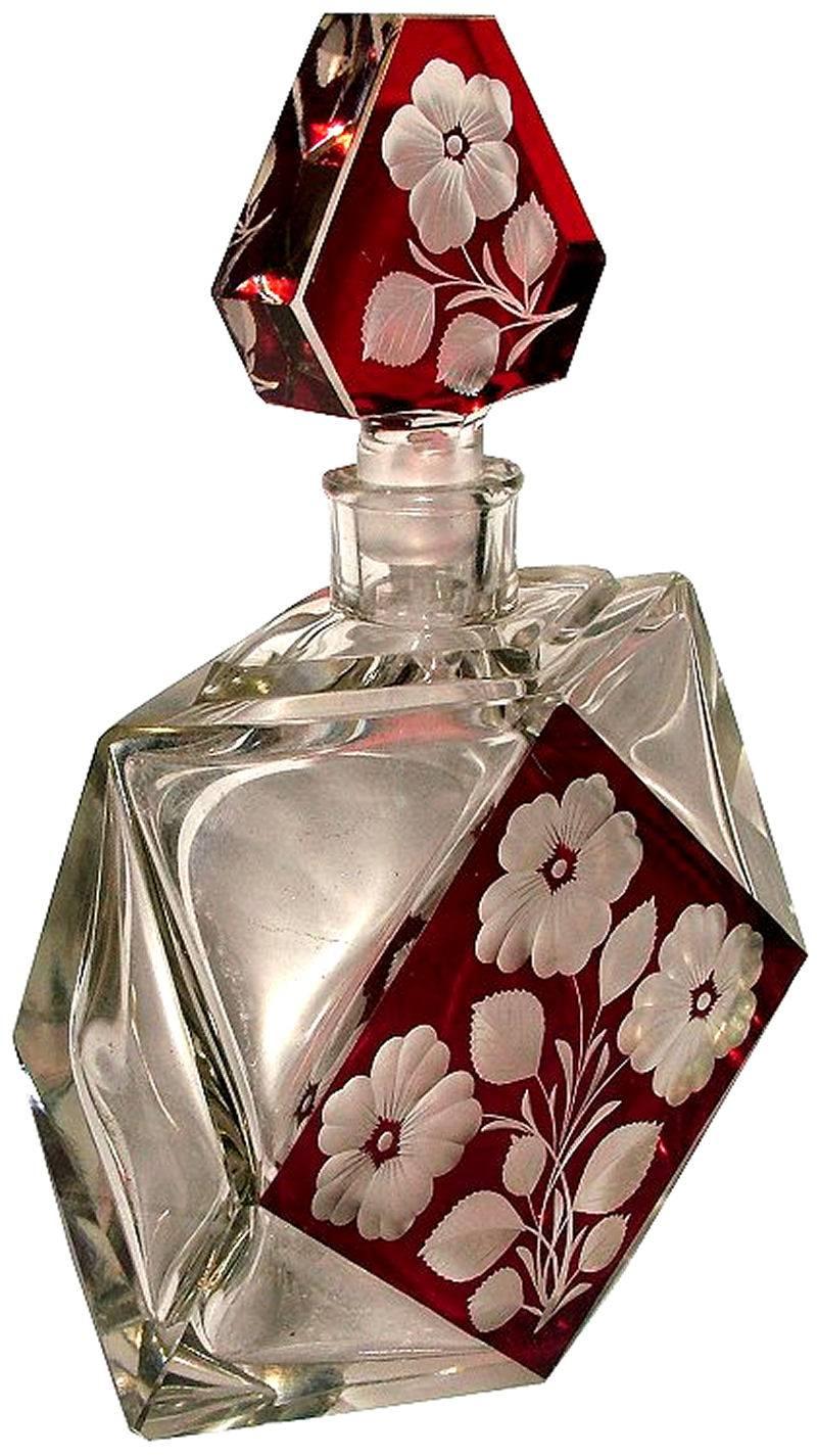 Stunning 1930s Art Deco decanter set originating from Czechoslovakia. Comprises decanter, stopper and six glasses. Clear heavy cut-glass with floral enamel decoration. The decanter is deceptively heavy a sign of real quality. All in perfect