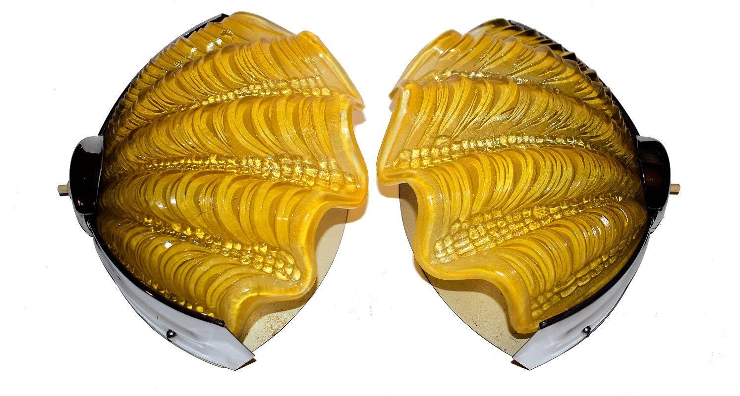 These are an identical matching pair of 1930s English shell wall lights or sconces in the very rare colorway of daffodil yellow. These look just as impressive switched on or off and what a wonderful and imaginative way to light your room. Both are