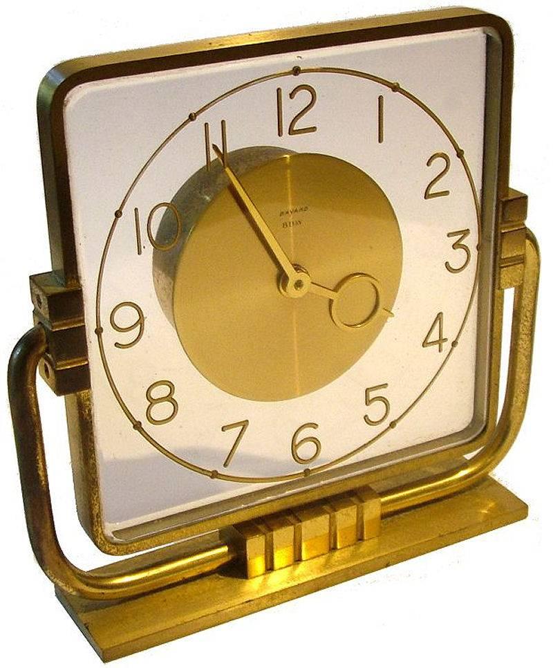 Very attractive 1930s Art Deco, French modernist clock by Bayard. Features a brass plinth that supports two brass arms that allow the dial to be rotated. Very destinctive looking clock, a fabulous timepiece for any setting or room. Condition is very