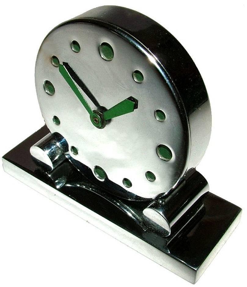 Very rare miniature modernist chrome clock, totally authentic and one we've not come across ever before in our 20 years of specialising in Art Deco. The numerals and hands are in green enamel. Condition is above average the chrome is bright and