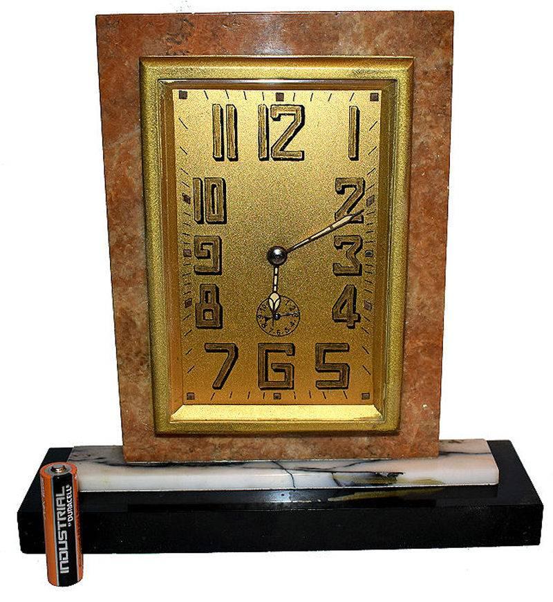 Extremely attractive and totally authentic 1930s Art Deco wind up clock. Originating from France and in a tri color solid marble case this clock is the epitome of Art Deco we all love. Highly stylised Deco numerals on a gilt face. This clock is an