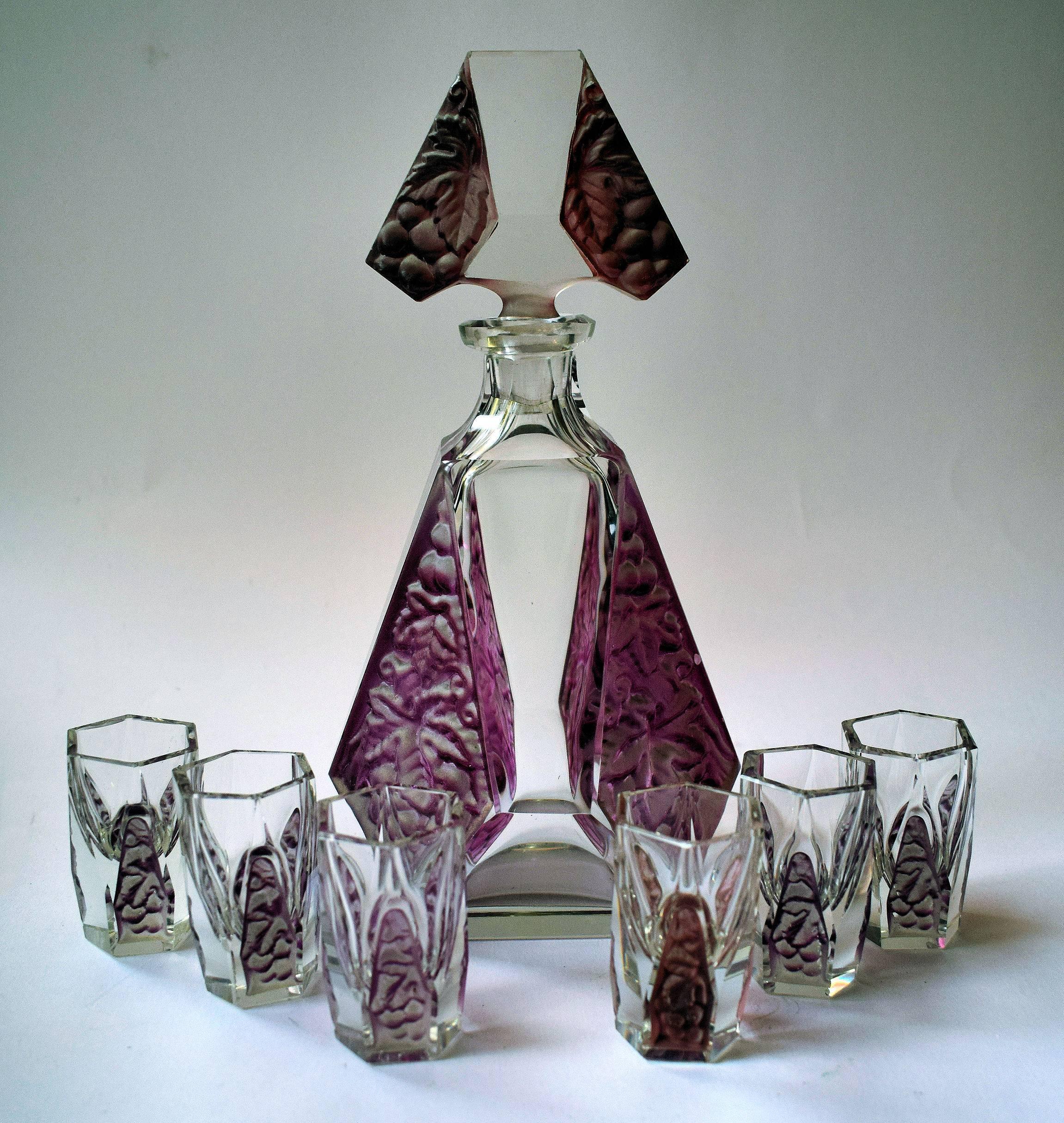 Beautiful 1930s Art Deco Bohemian decanter set comprises seven pieces, comprising decanter and it's stopper and six delightful glasses, a truly magnificent example of Pre War Czechoslovakian glass. This stunning set is in MINT condition, and a set