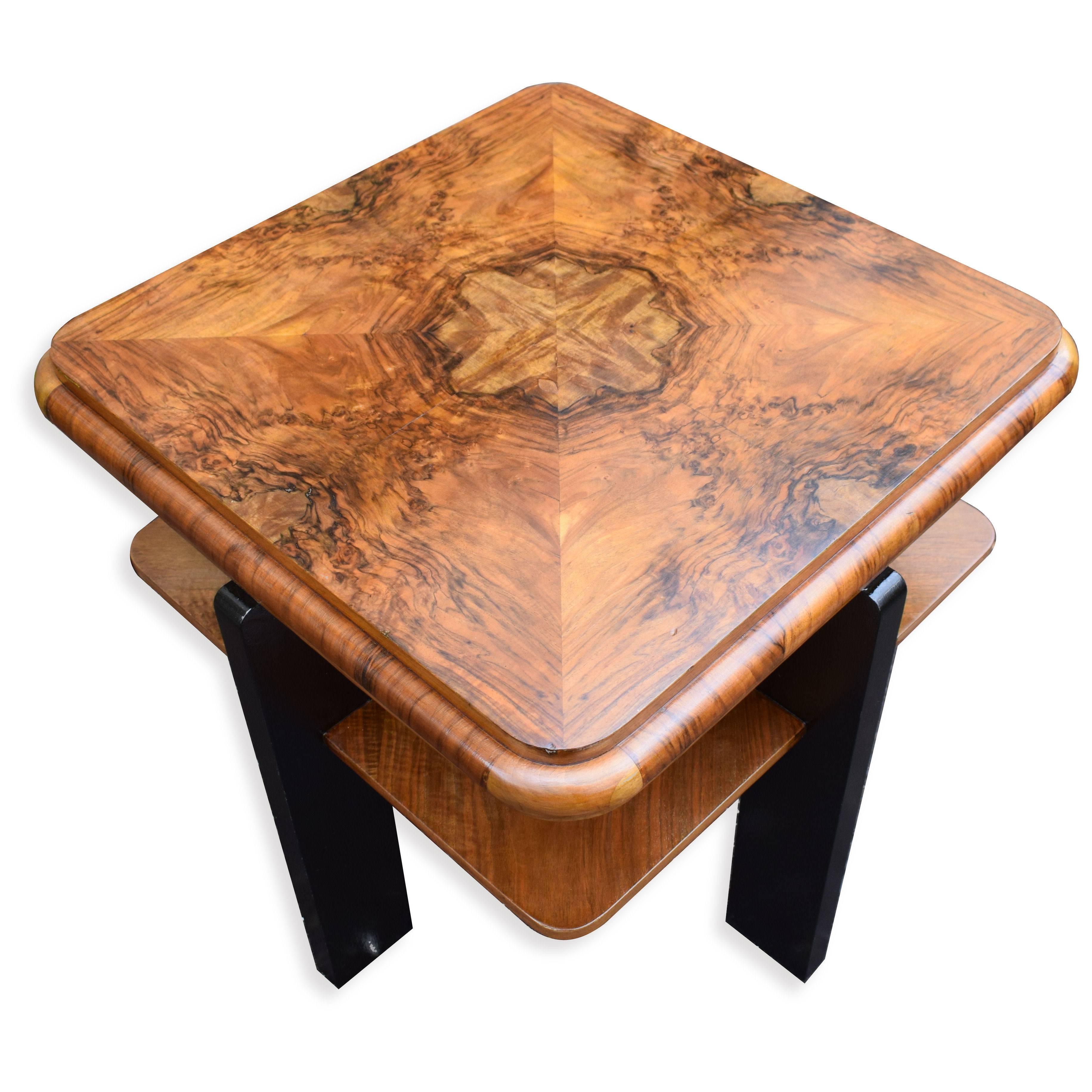 For your consideration is this outstanding 1930s English two tiered occasional table in luxious walnut veneers. This table ouzes quality, the top is heavily figured and is eight quarter veneered rather than four so that you get the full center of