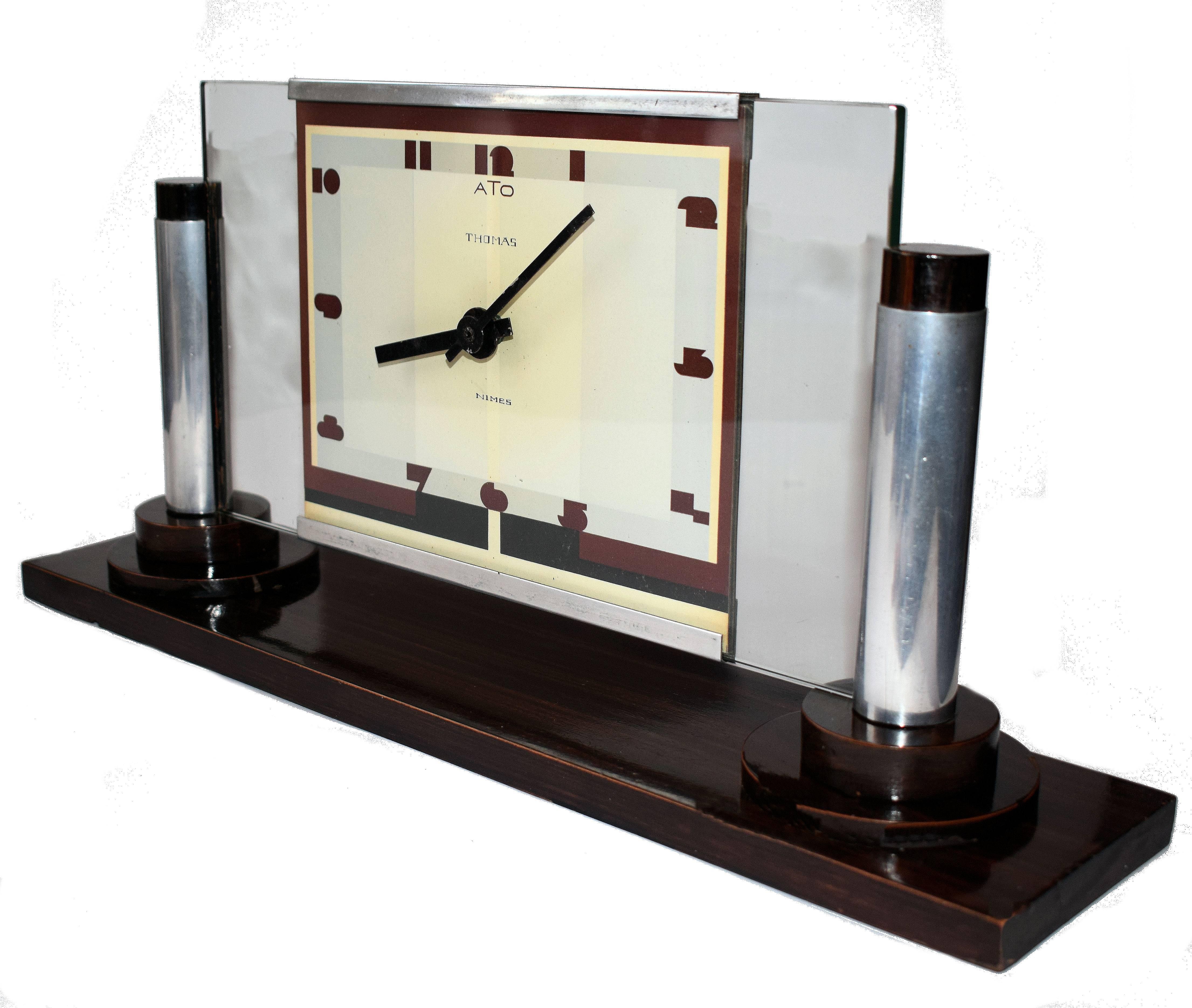 
This clock really does have the wow factor. Impressive not only by its design but also its size - see all pics for IDEA of dimensions. A mixture of materials used is Rosewood, Chrome and glass. One of the better examples of ATO Clocks that we're