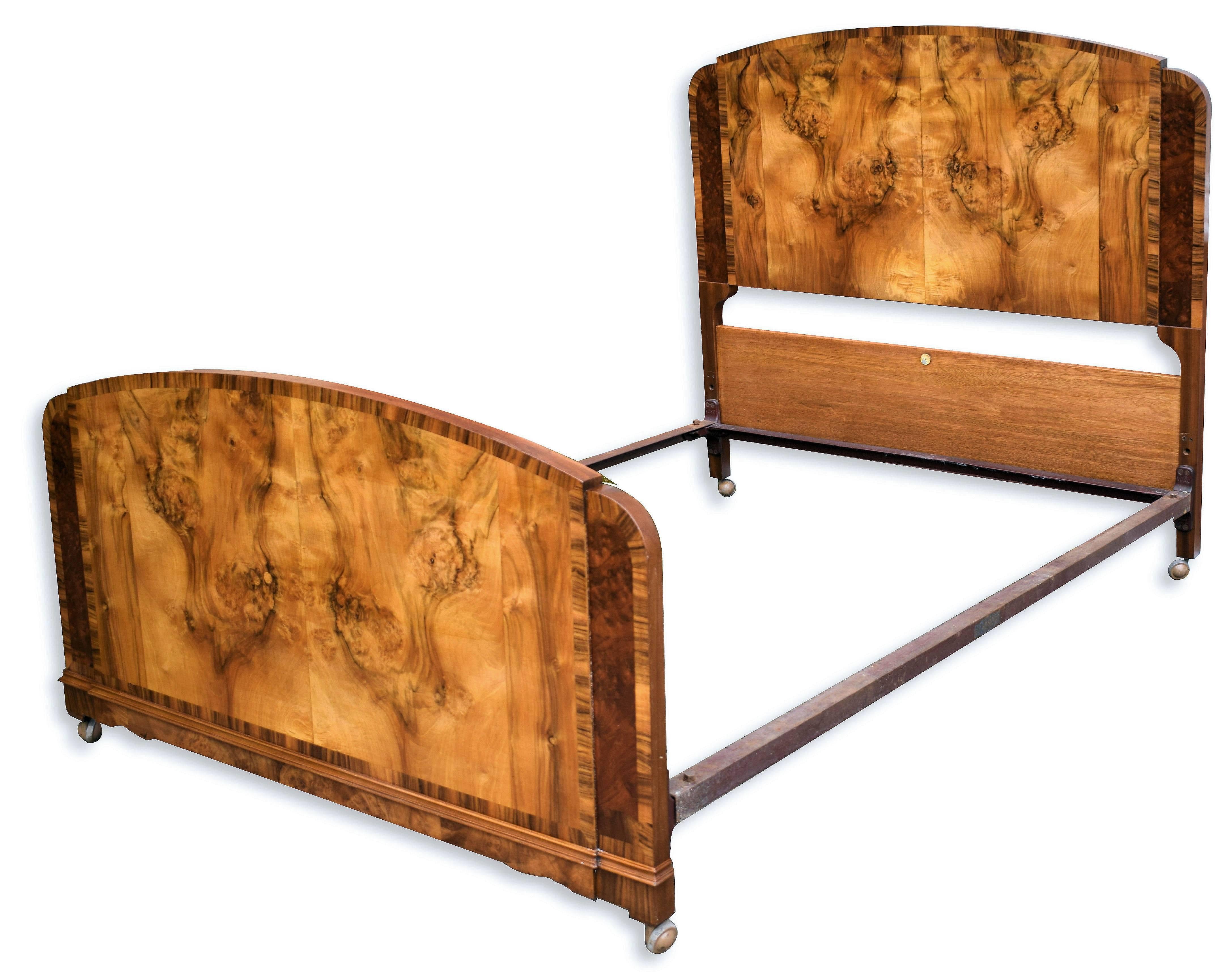 Fabulous 1930s Art Deco walnut bed originates from England. The veneers are so beautifully detailed, the quality oozes from this bed. Features headboard, footboard and two side irons. We've had this bed fully restored in our workshops so it comes to